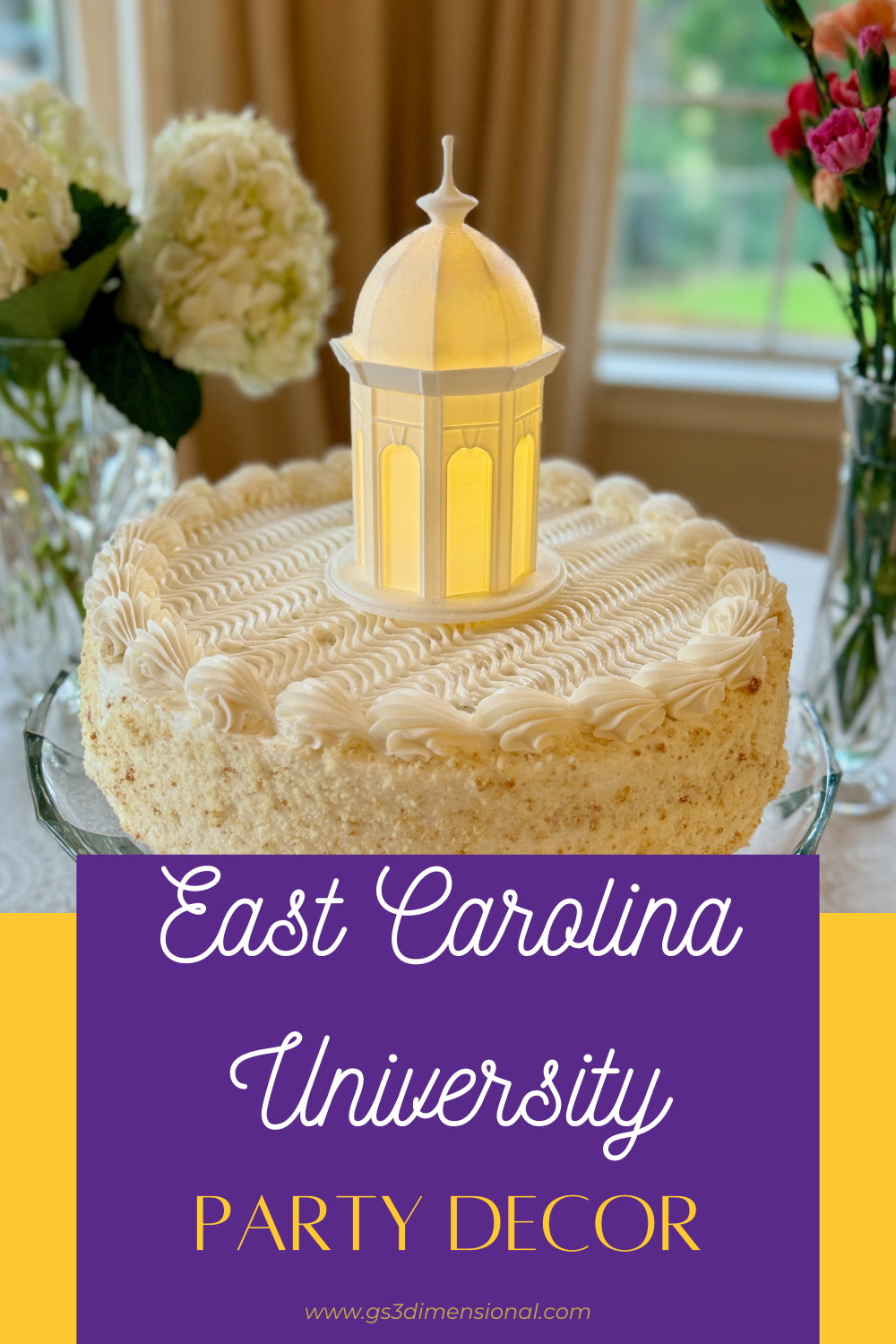 The East Carolina cake topper designed as the ECU Cupola building, and shown on a graduation or wedding cake.