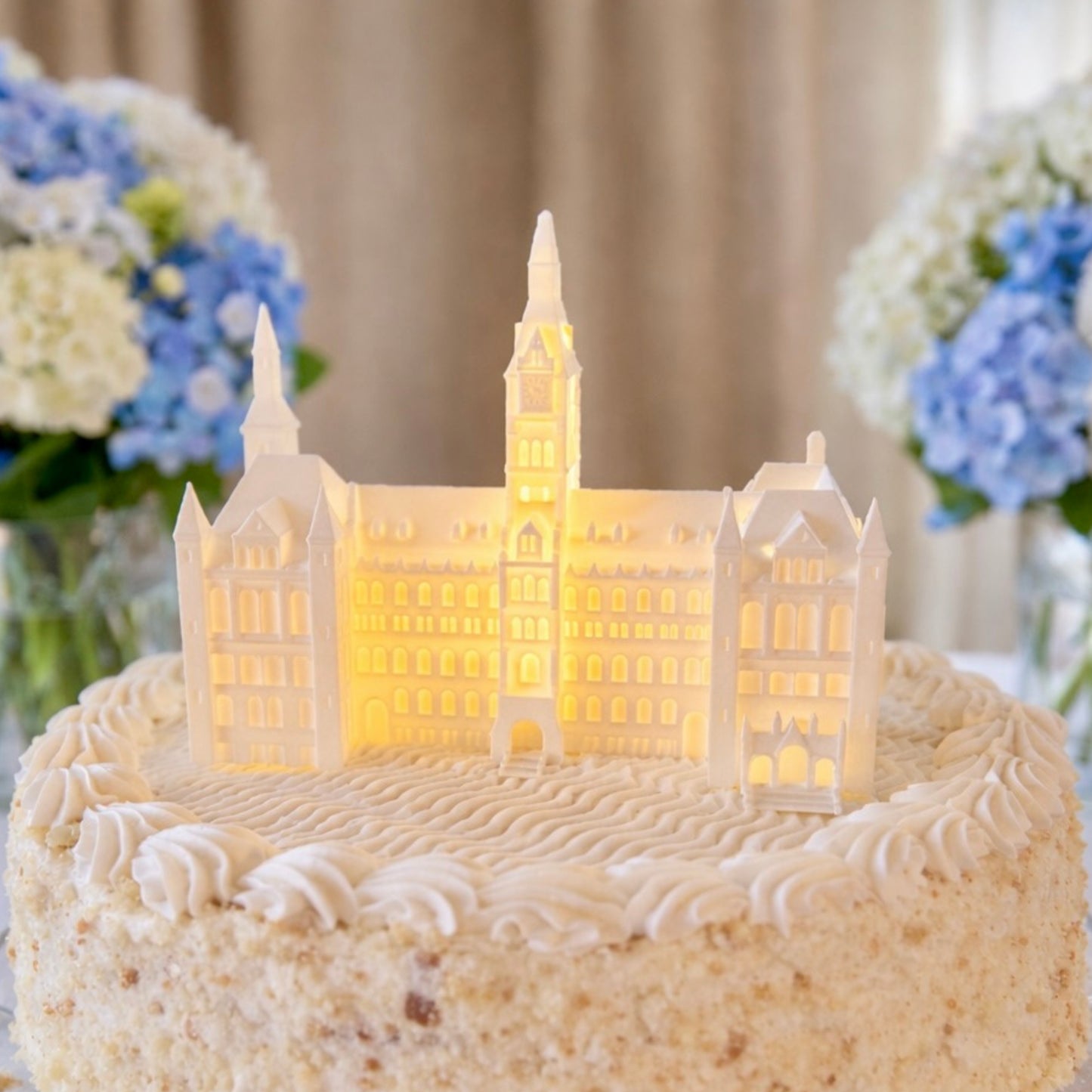 The Georgetown University cake topper light, designed as the Healy Hall building and shown on a graduation cake.