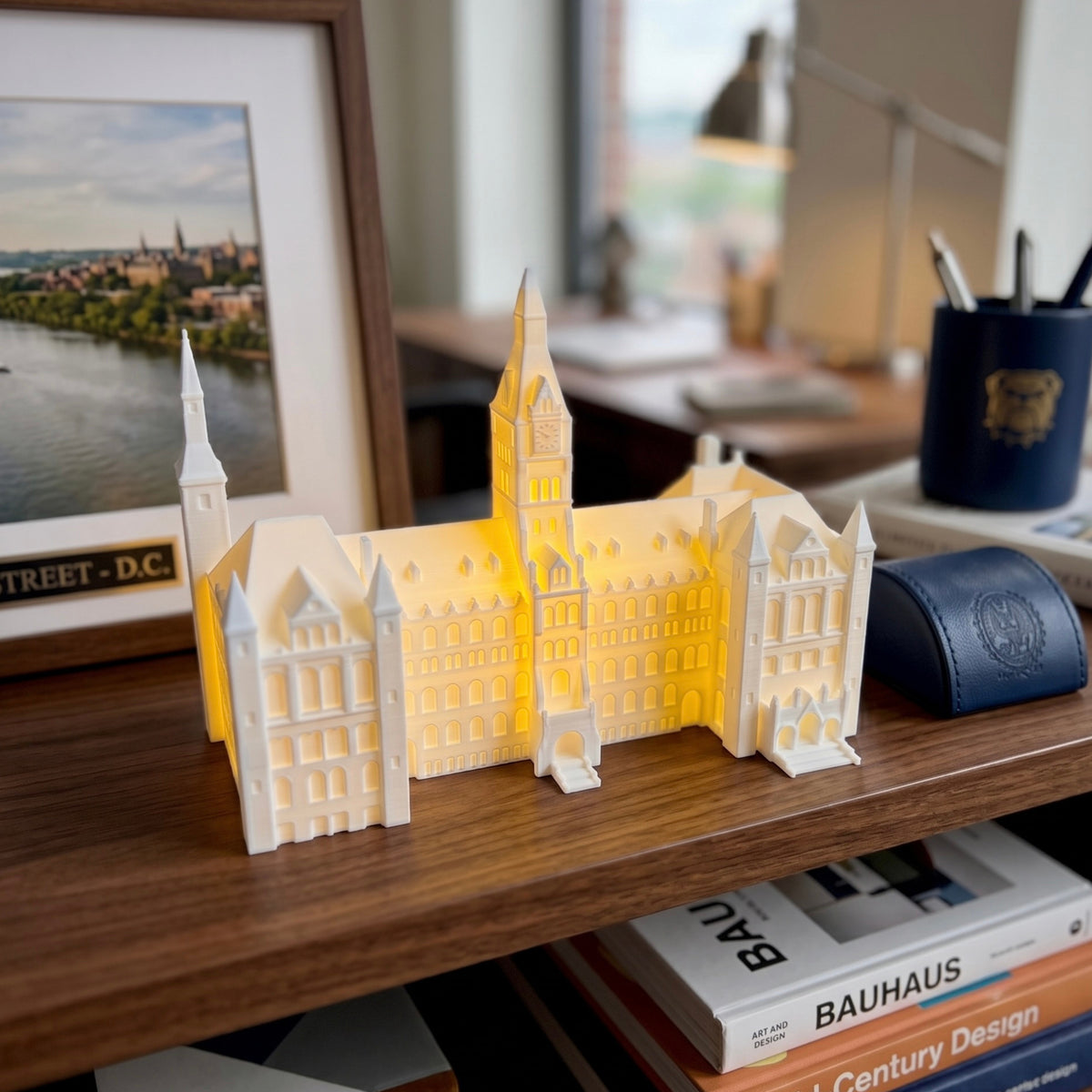 The Healy Hall LED light, shown on the shelf and used as office decor for a Georgetown University alumni.