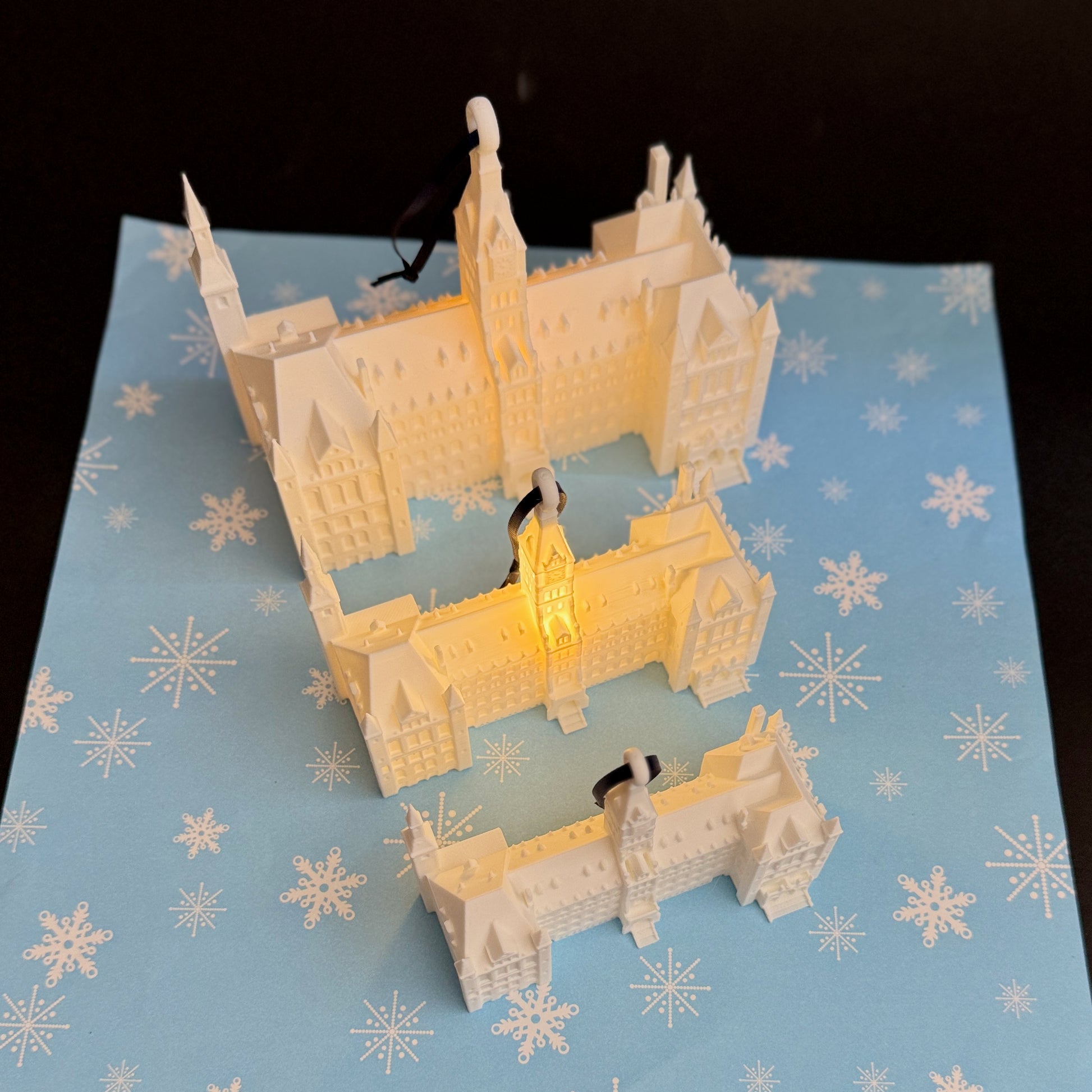 Size comparison of the Healy Hall ornaments, designed as Georgetown University graduation gifts.