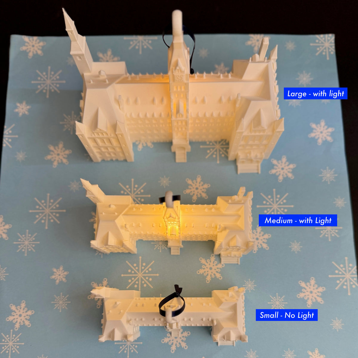 Size comparison of the Georgetown University lighted ornaments designed as Healy Hall.