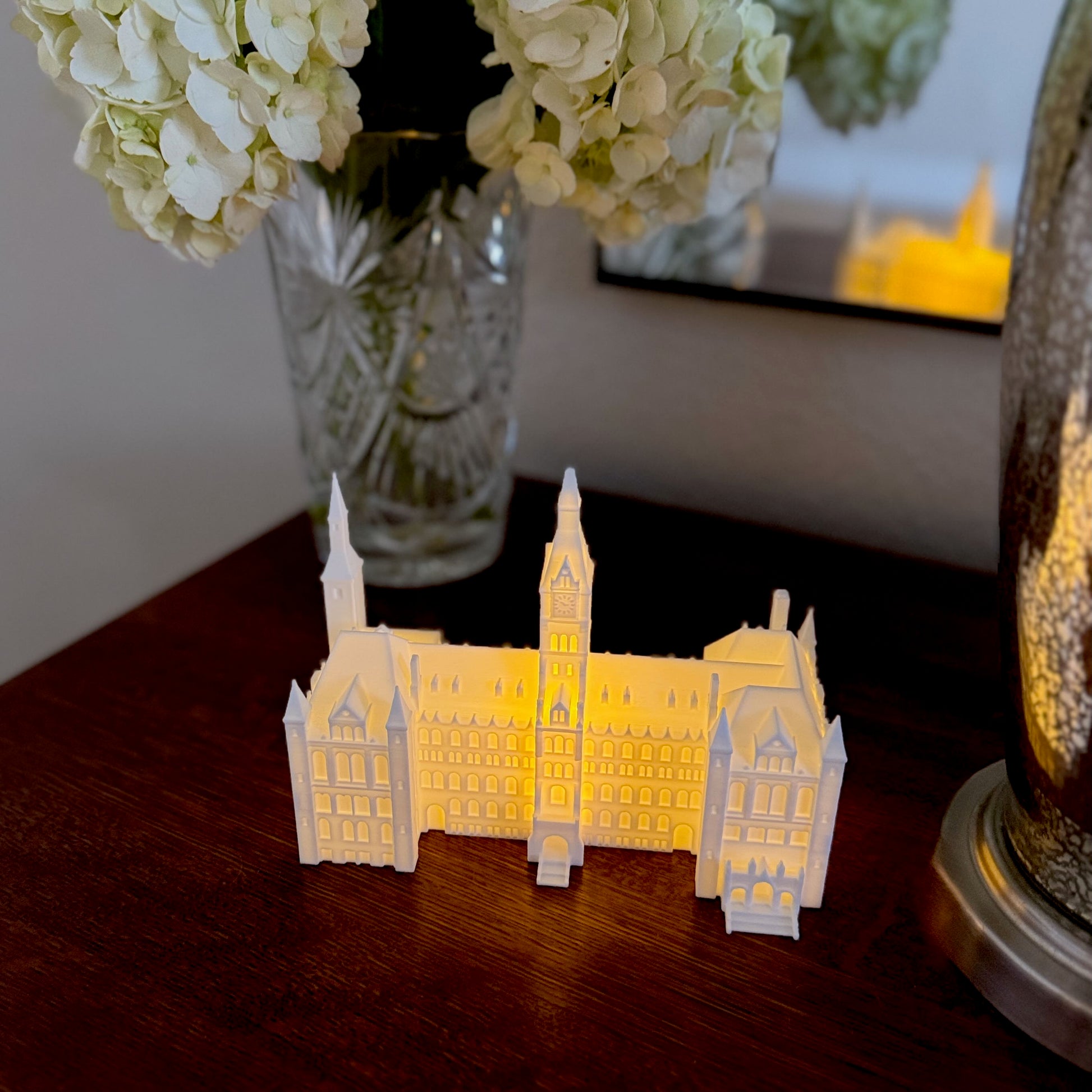 The Georgetown figurine with a light, used as home decor and shown on a bedroom side table.