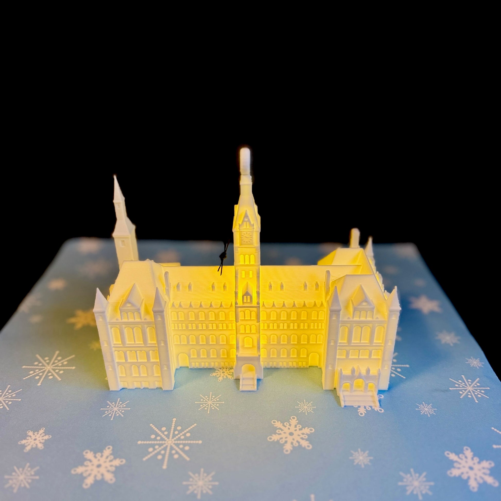 The lighted Georgetown University Ornament featuring the Healy Hall building on campus.