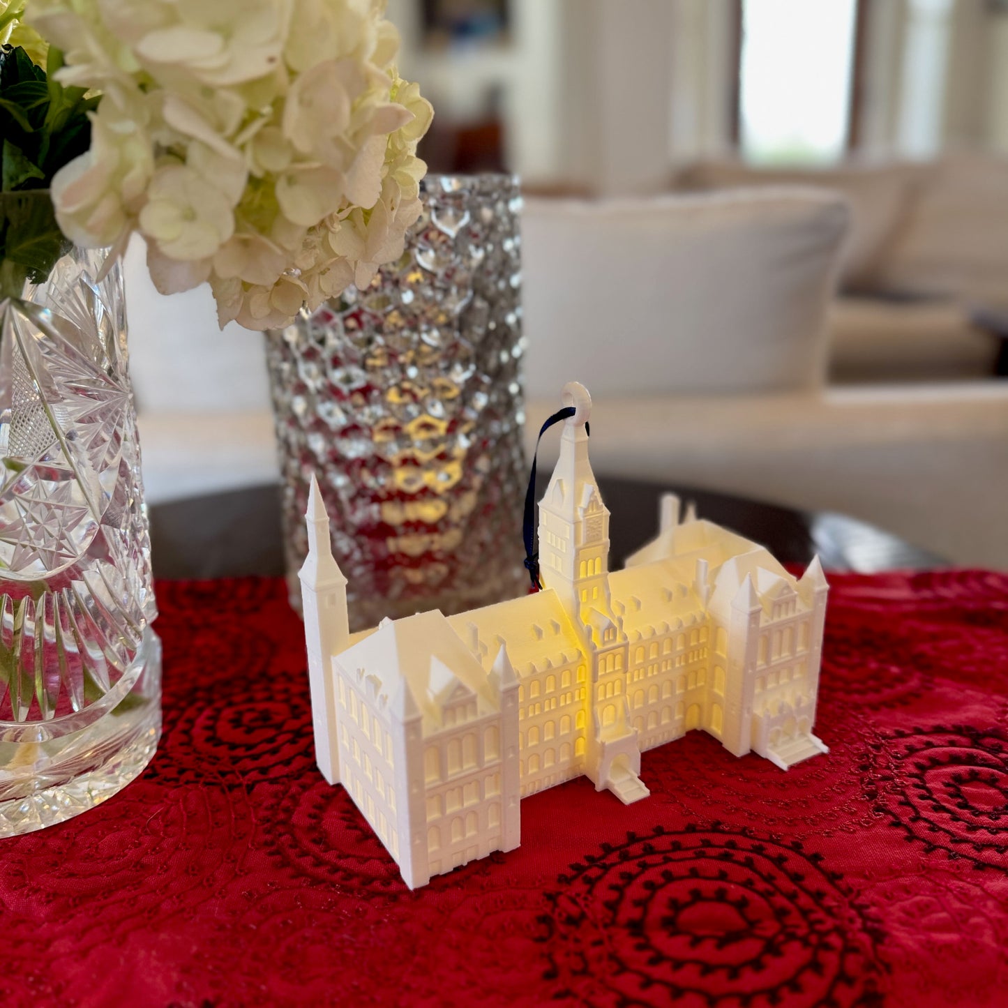 The lighted Georgetown ornament of the main campus, featuring Healy Hall.