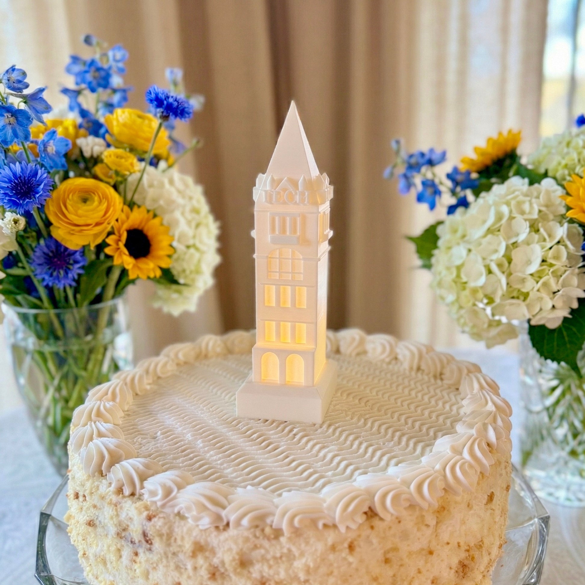 The Georgia Tech Tower cake topper, shown on a groom's cake or graduation cake, designed with an LED light.