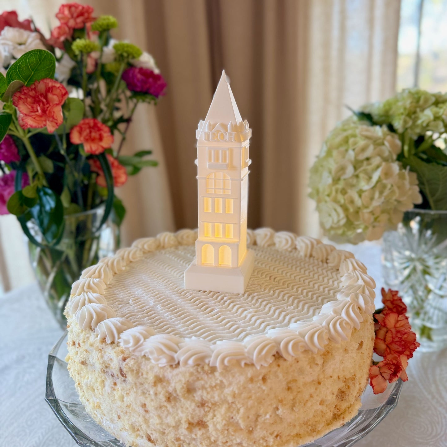 The Georgia Tech Tower cake topper, shown on a Georgia Tech graduation cake.