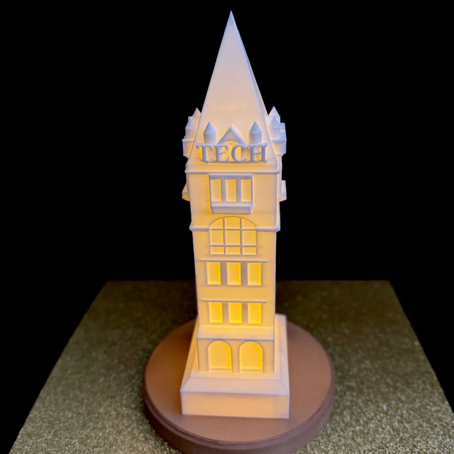 The large Georgia Tech Tower light, shown against a black background.