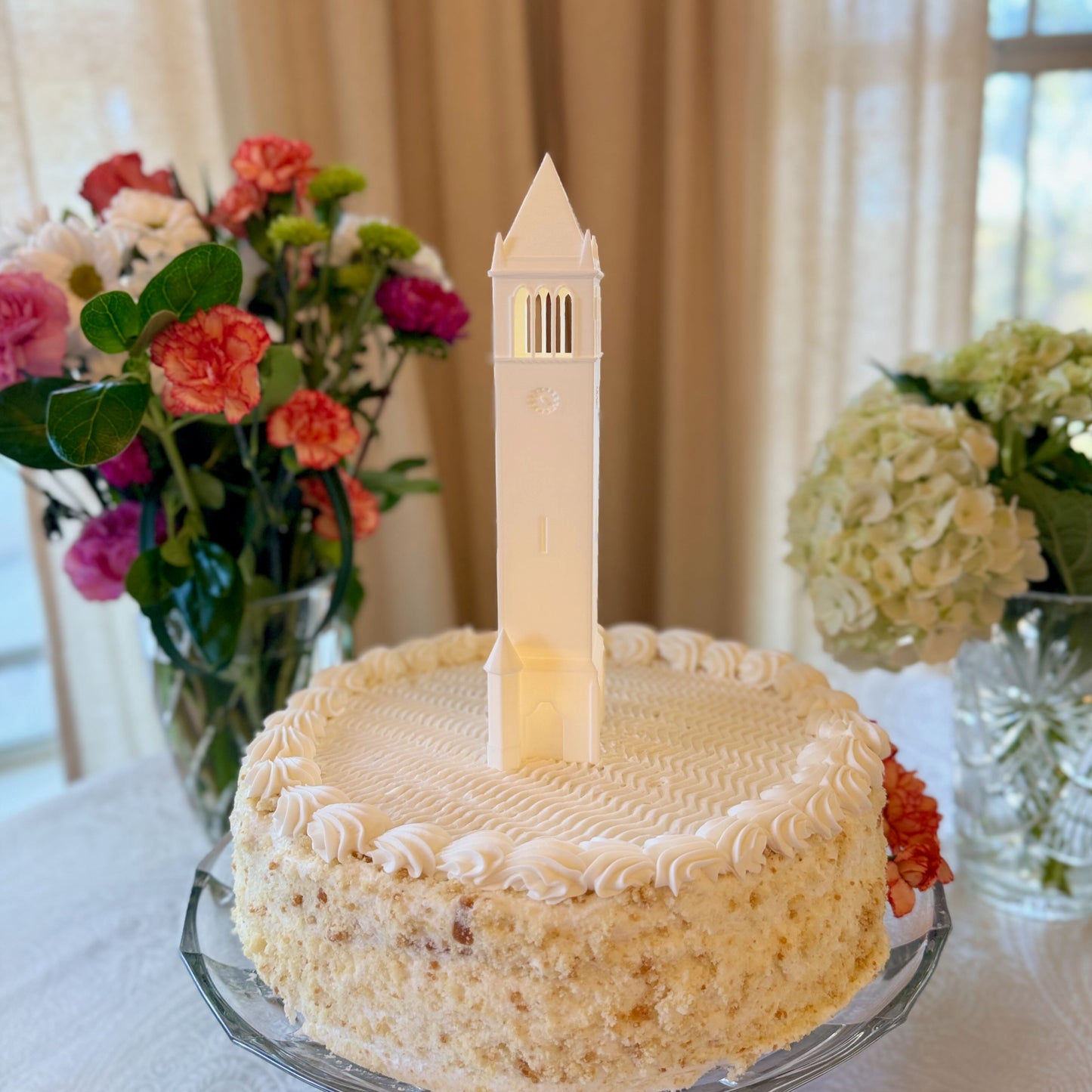 The Iowa State Campanile cake topper, shown on an Iowa State graduation cake.