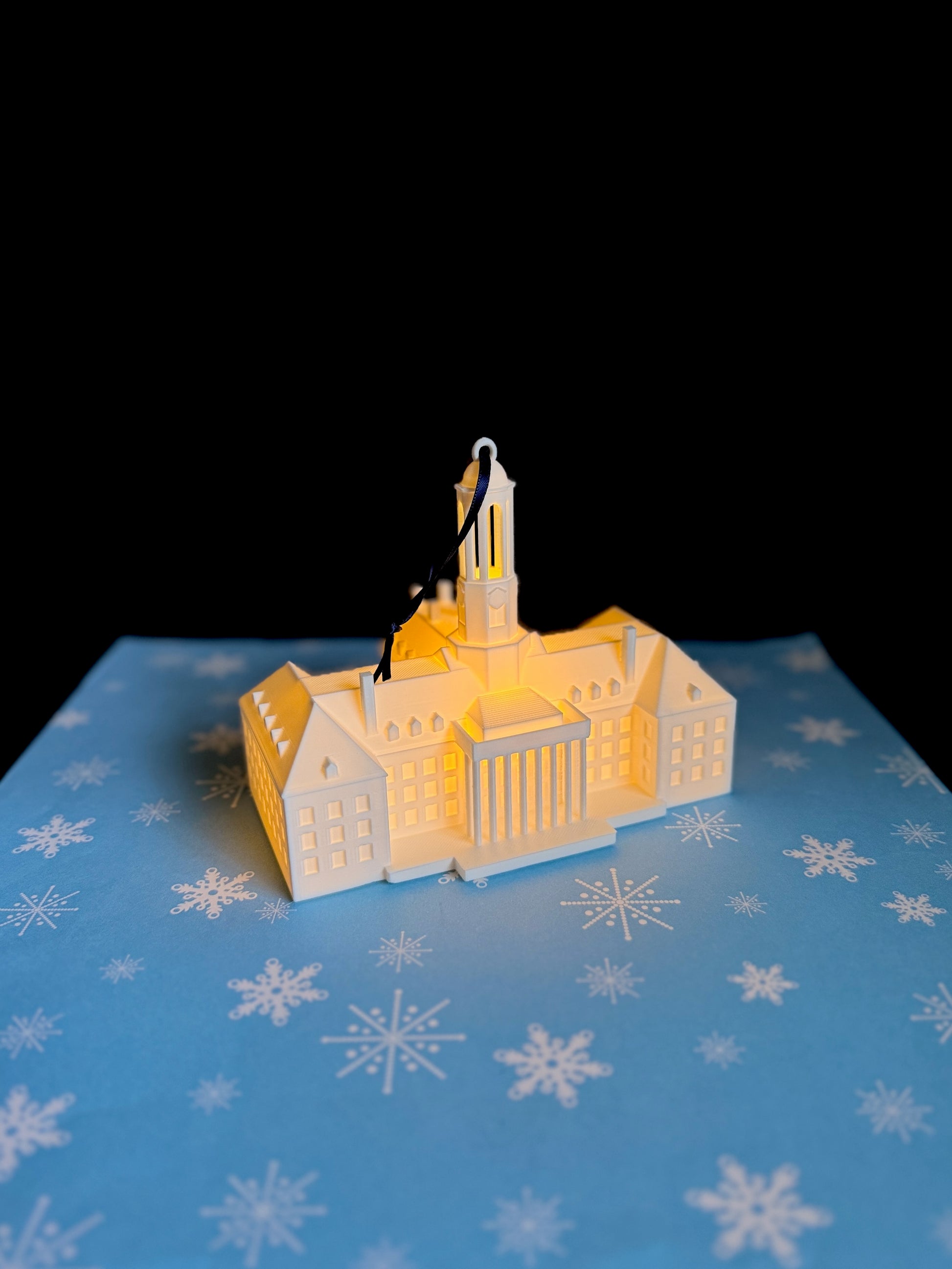 The lighted Penn State ornament of Old Main.