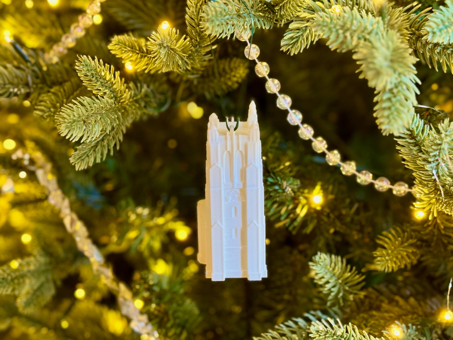 Michigan State Spartans ornament shown on a tree.