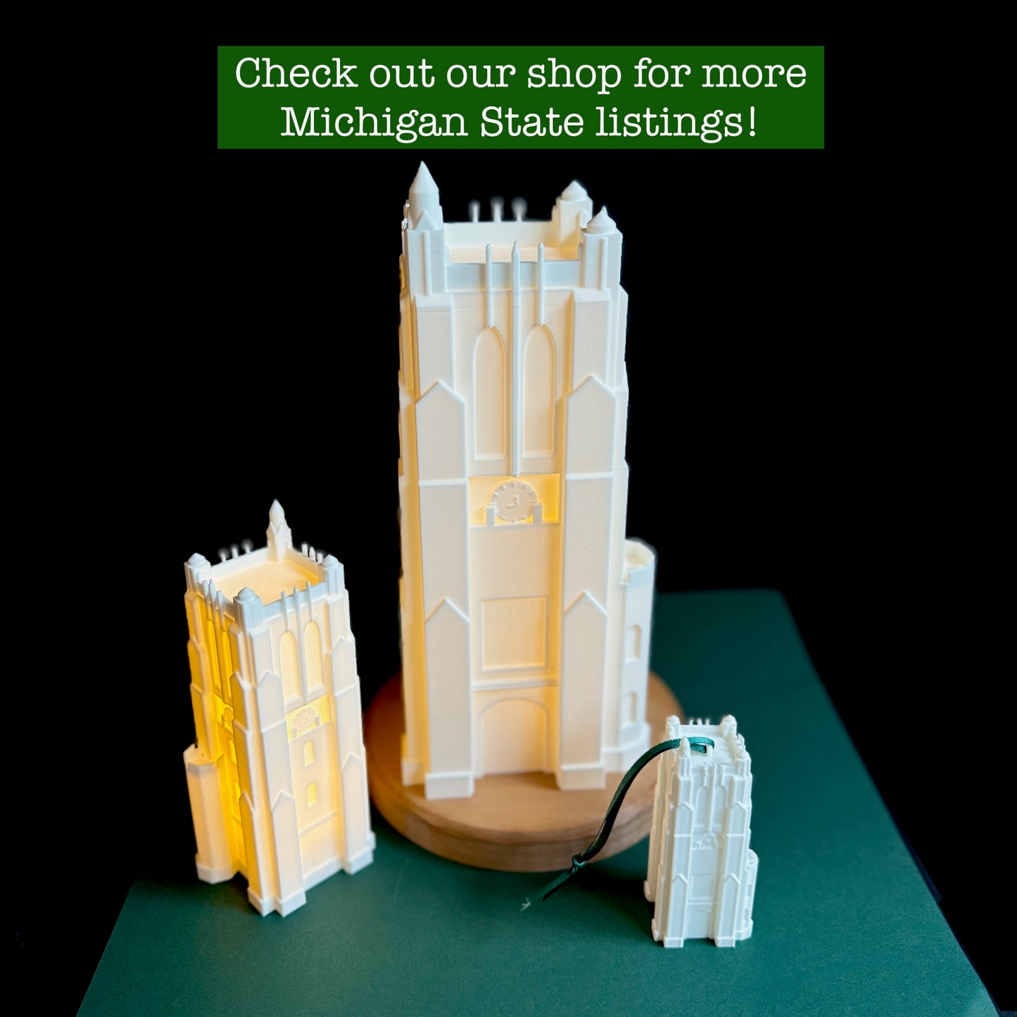 The Michigan State University gifts designed as a Beaumont Tower light, shown in large and small versions, along with an MSU ornament.