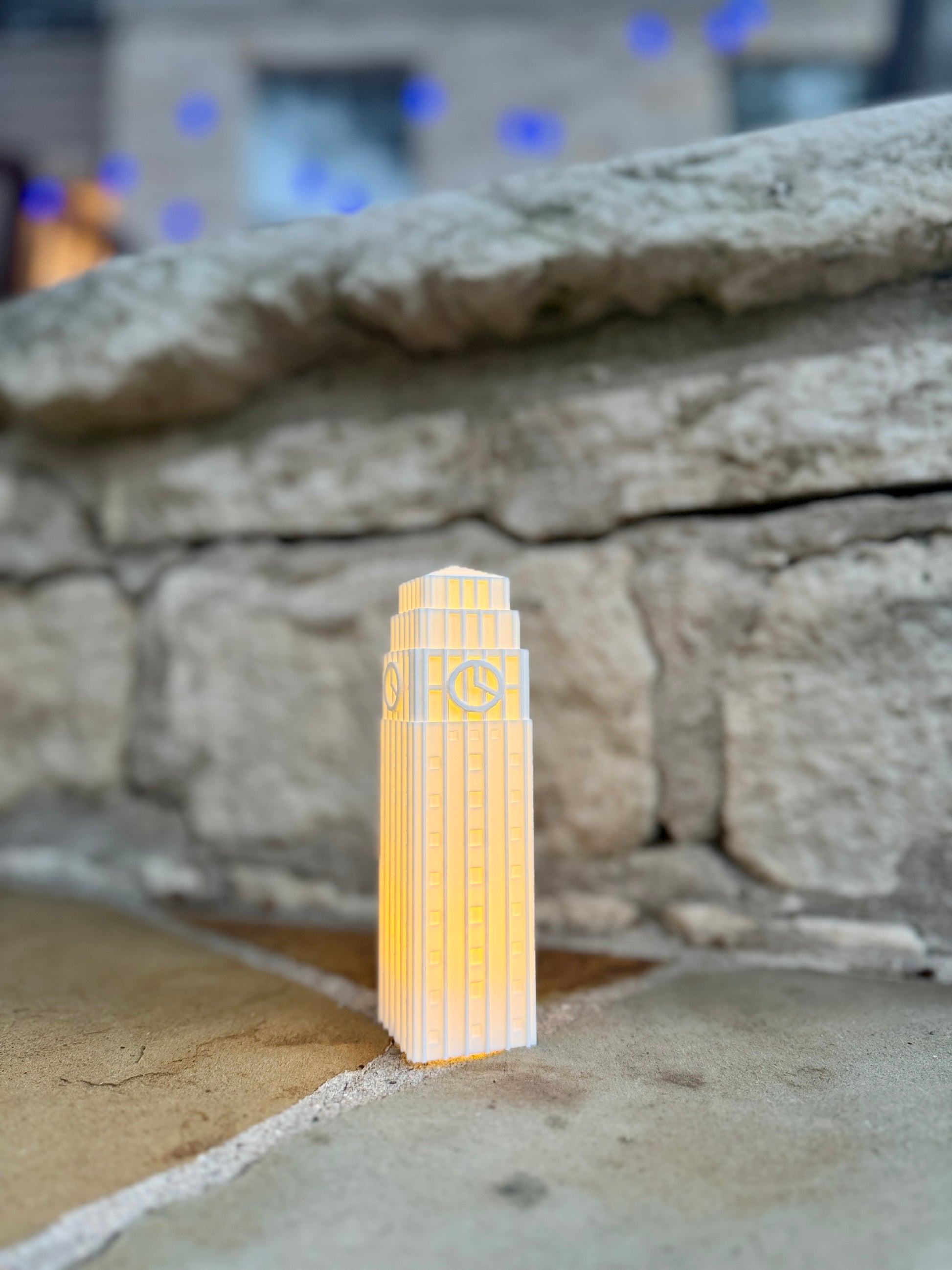 Michigan Wolverines figurine representing Burton tower, shown at an outdoor party.