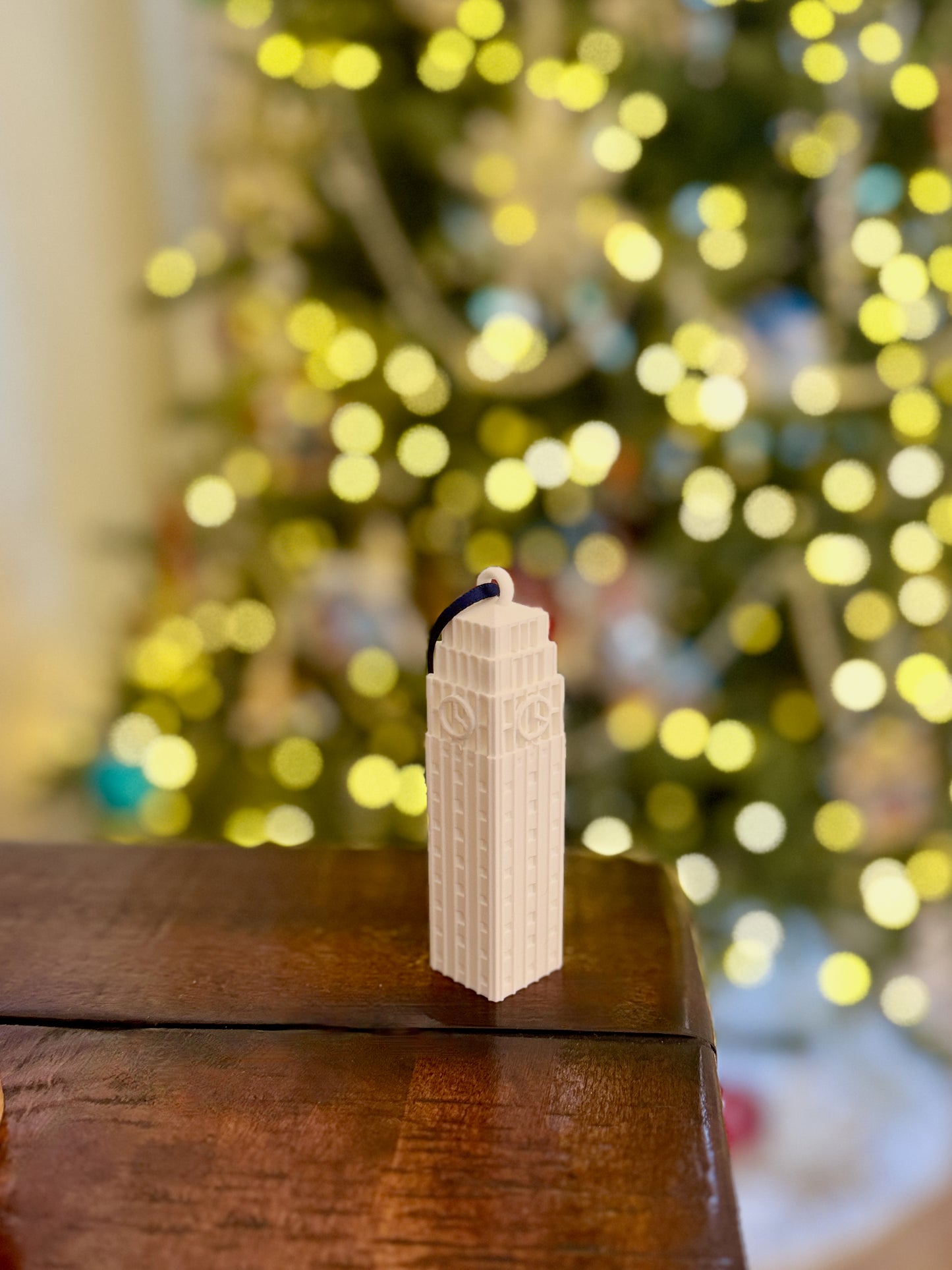 The Michigan Wolverines ornament  shown in a home decorated for Christmas.