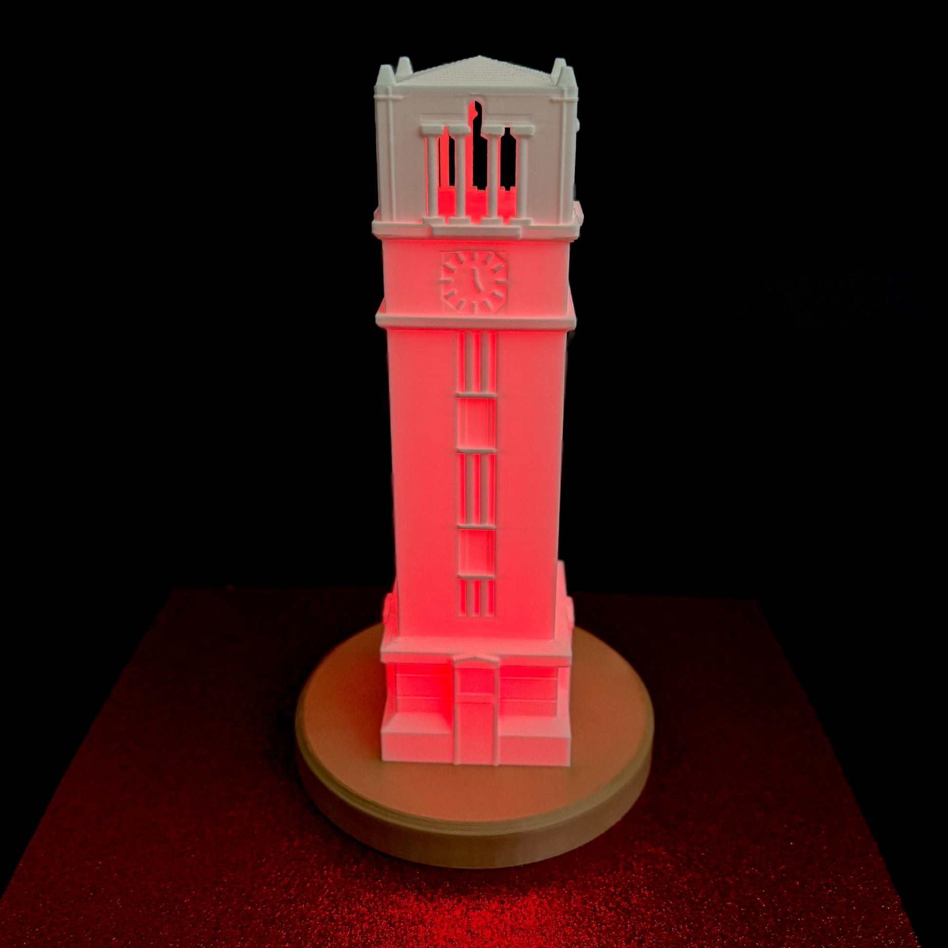 The large NC State tower with a red LED light.