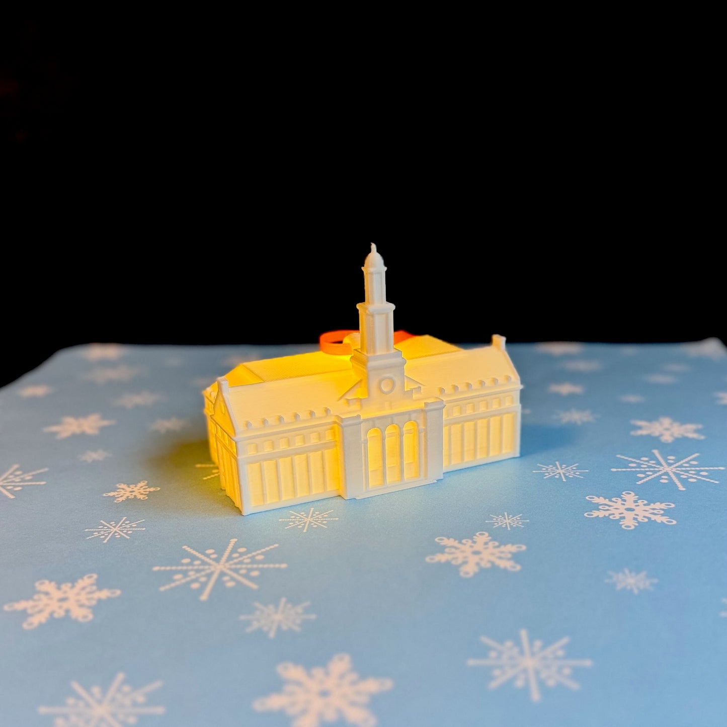 Miniature glowing replica of the Edmon Low Library in Stillwater for an OSU Christmas tree.