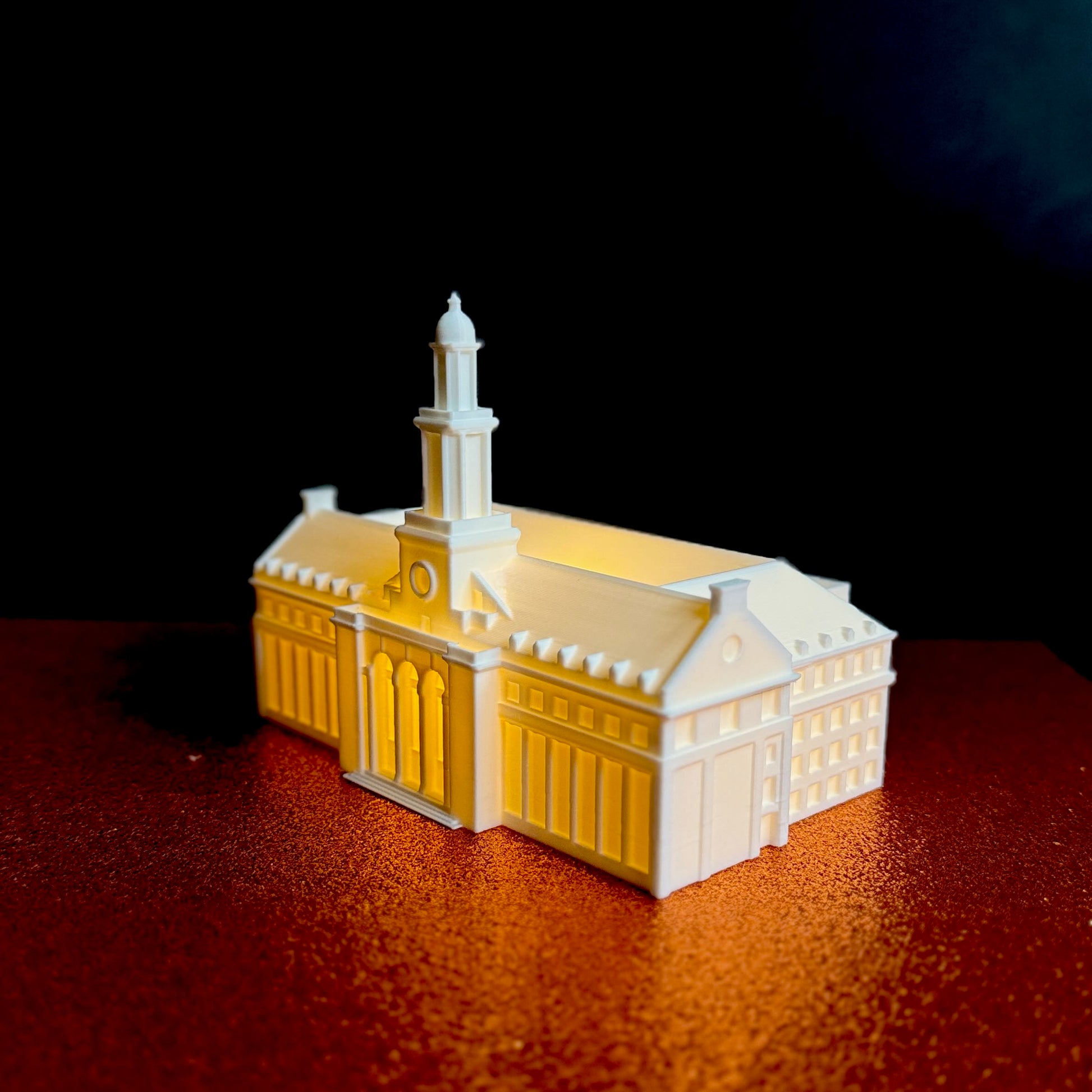 Side angle of the glowing Edmon Low Library 3D printed figurine for OSU Cowboys fans.