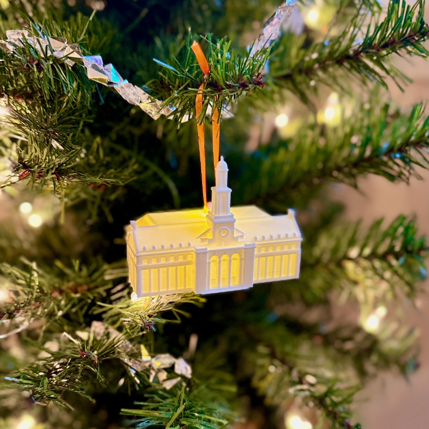 Close up of the architectural details on a 3D printed Edmon Low Library model ornament on Christmas tree.