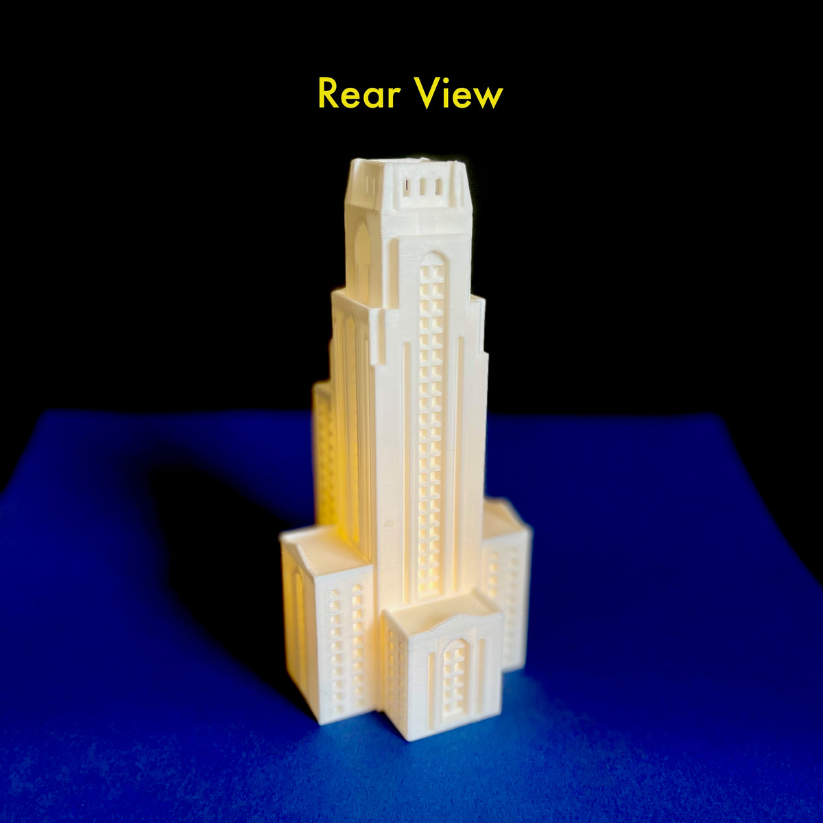 Rear view of the Pitt Cathedral of Learnng figurine.