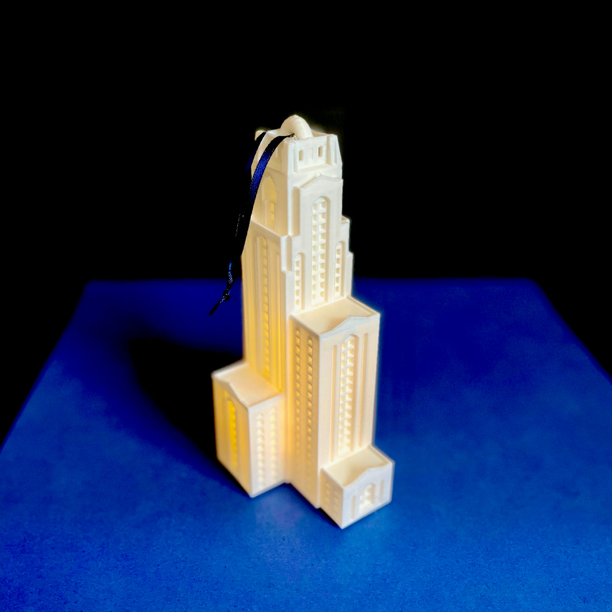 The University of Pittsburgh ornament designed as the Pitt Cathy building with an LED light.