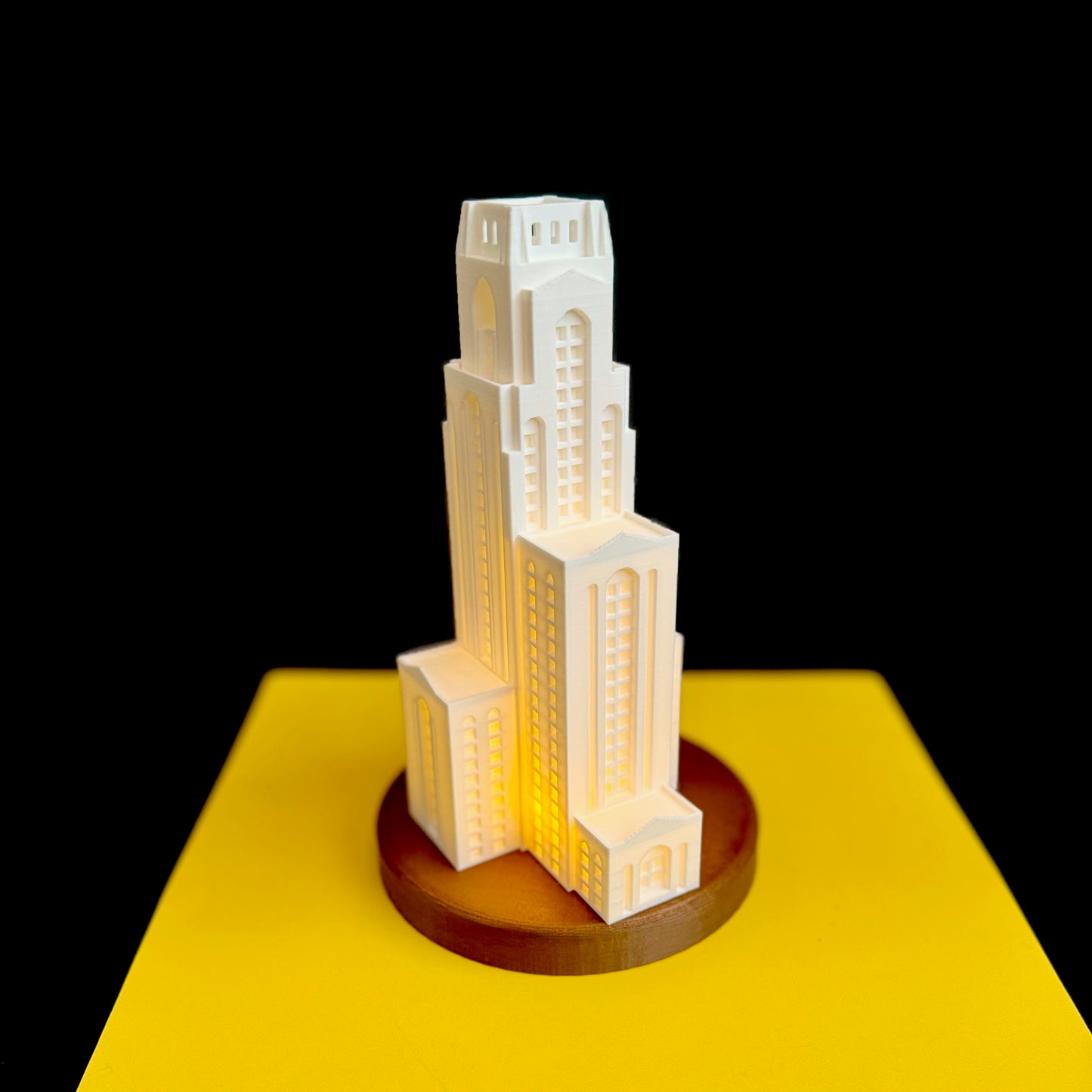 The University of Pittsburg Pitt Cathy lamp, shown against a yellow background.