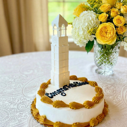 The Purdue cake topper lighted figurine, designed as a replica of the bell tower building on the Lafayette campus.