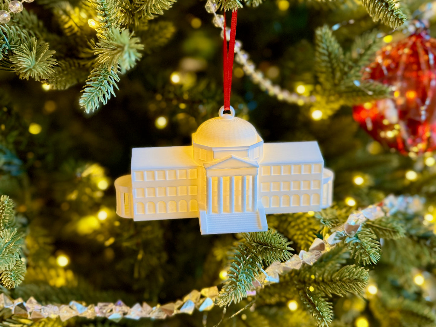 The SMU Dallas Hall ornament shown on an SMU Christmas tree.