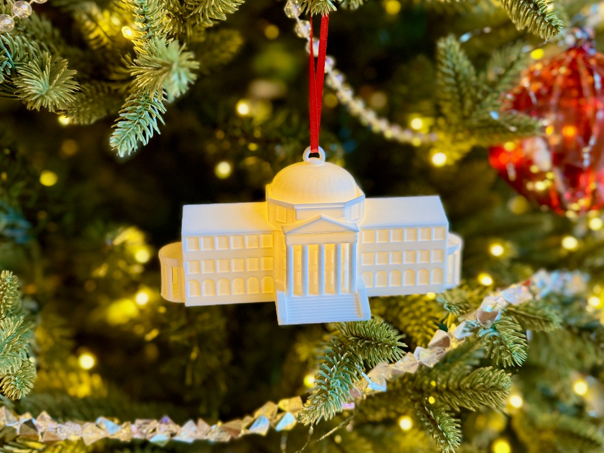 The SMU Dallas Hall ornament shown on an SMU Christmas tree.