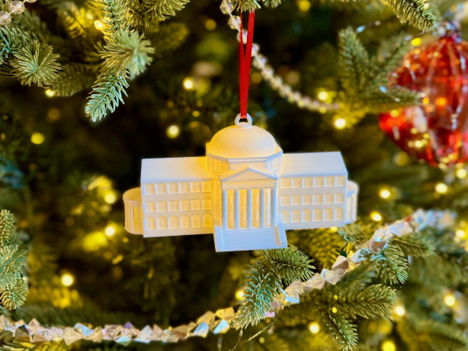 SMU Dallas Hall ornament on a Christmas tree.