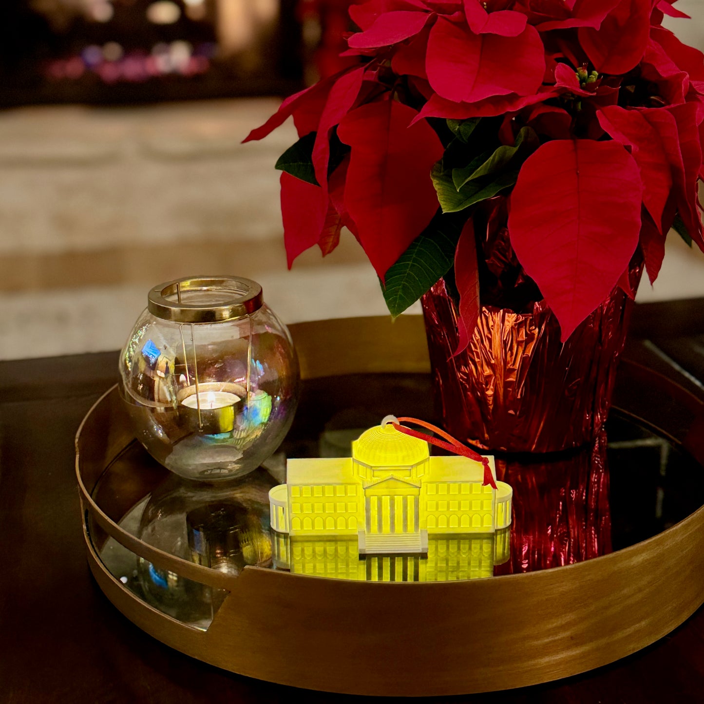 The lighted SMU ornament featuring Dallas Hall. Shown in a college dorm room.