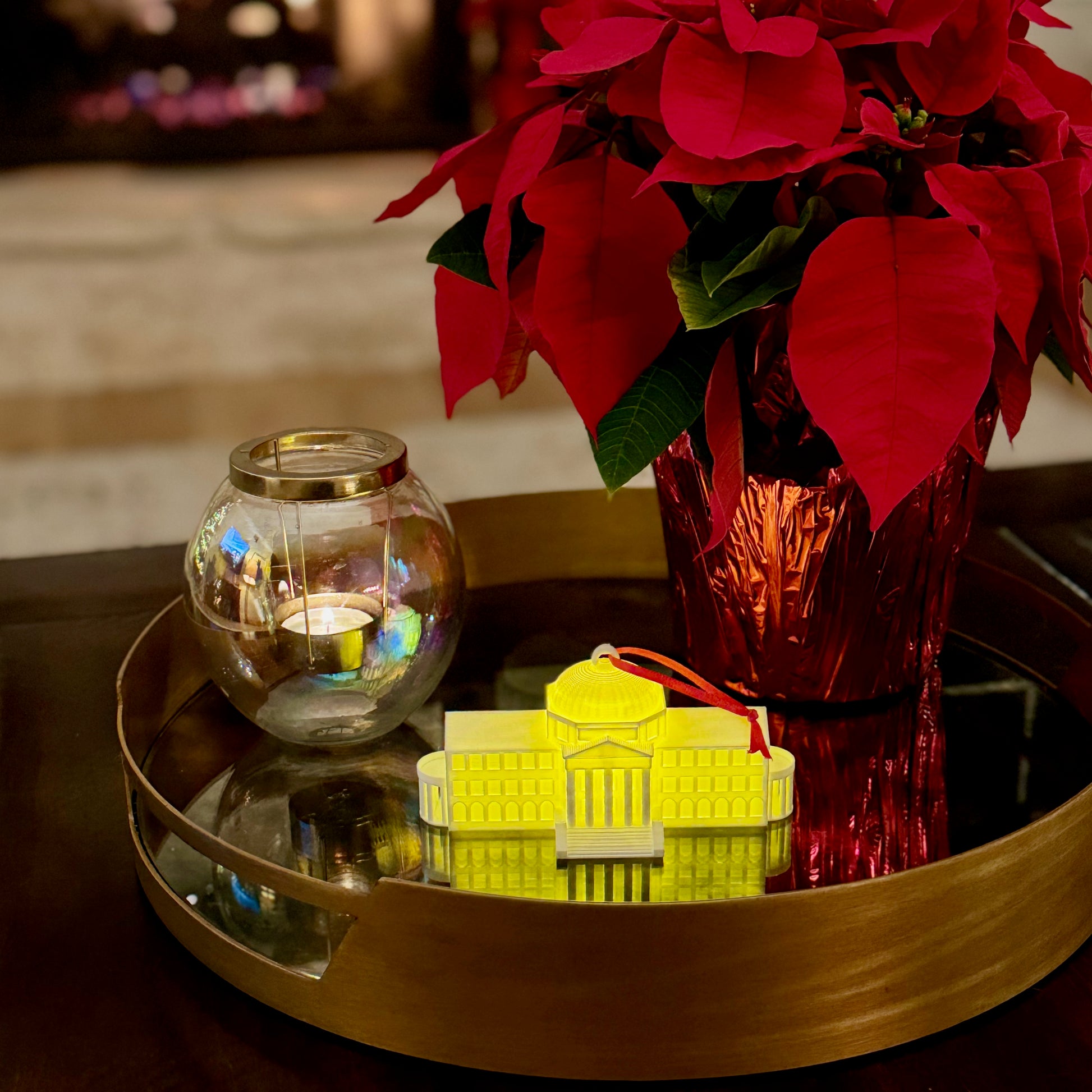 The lighted SMU ornament featuring Dallas Hall. Shown in a college dorm room.
