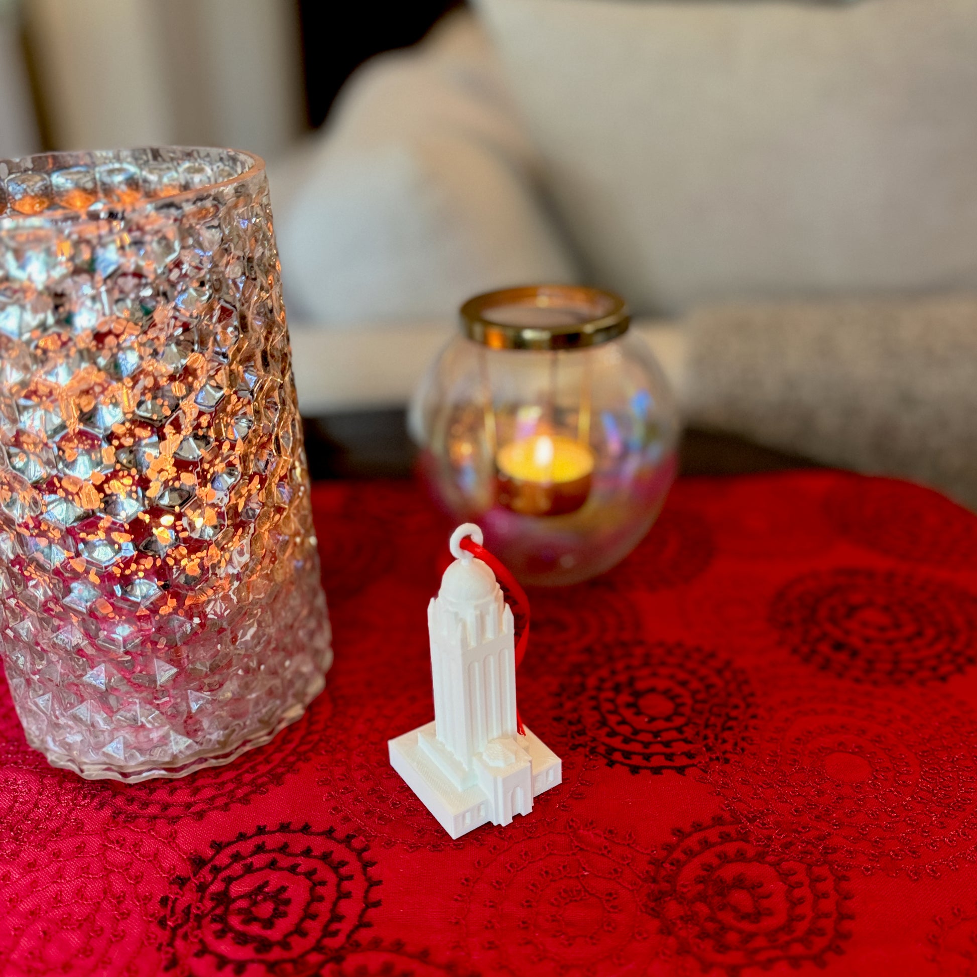The Stanford Hoover Tower college ornament, shown in a home decorated for Christmas.