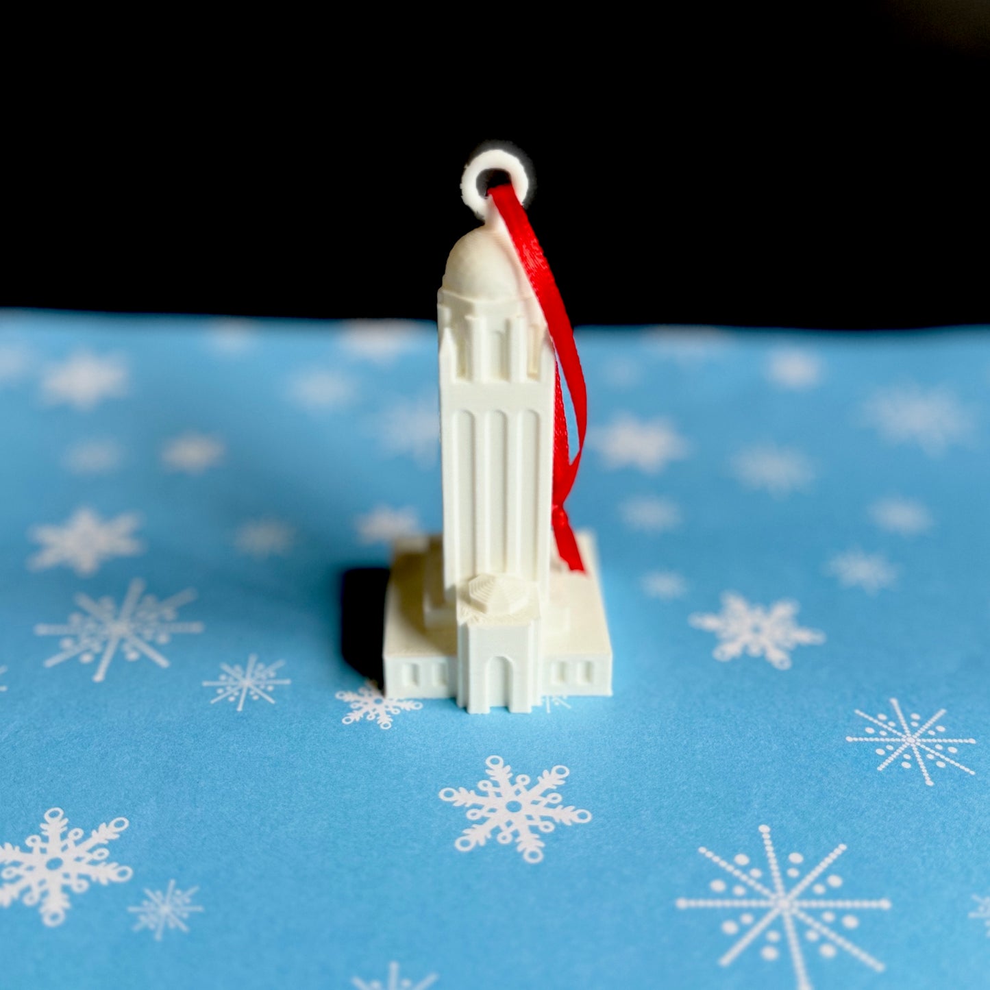Front view of the Stanford University christmas gift ornament, styled after the Hoover Tower.