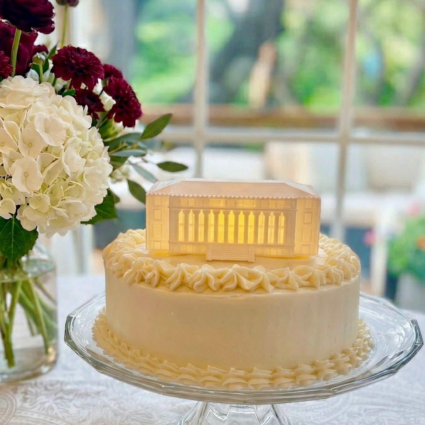 The Texas A&M cake topper light featuring the Administration building on the College Station campus and shown on a graduation cake or groom's cake.