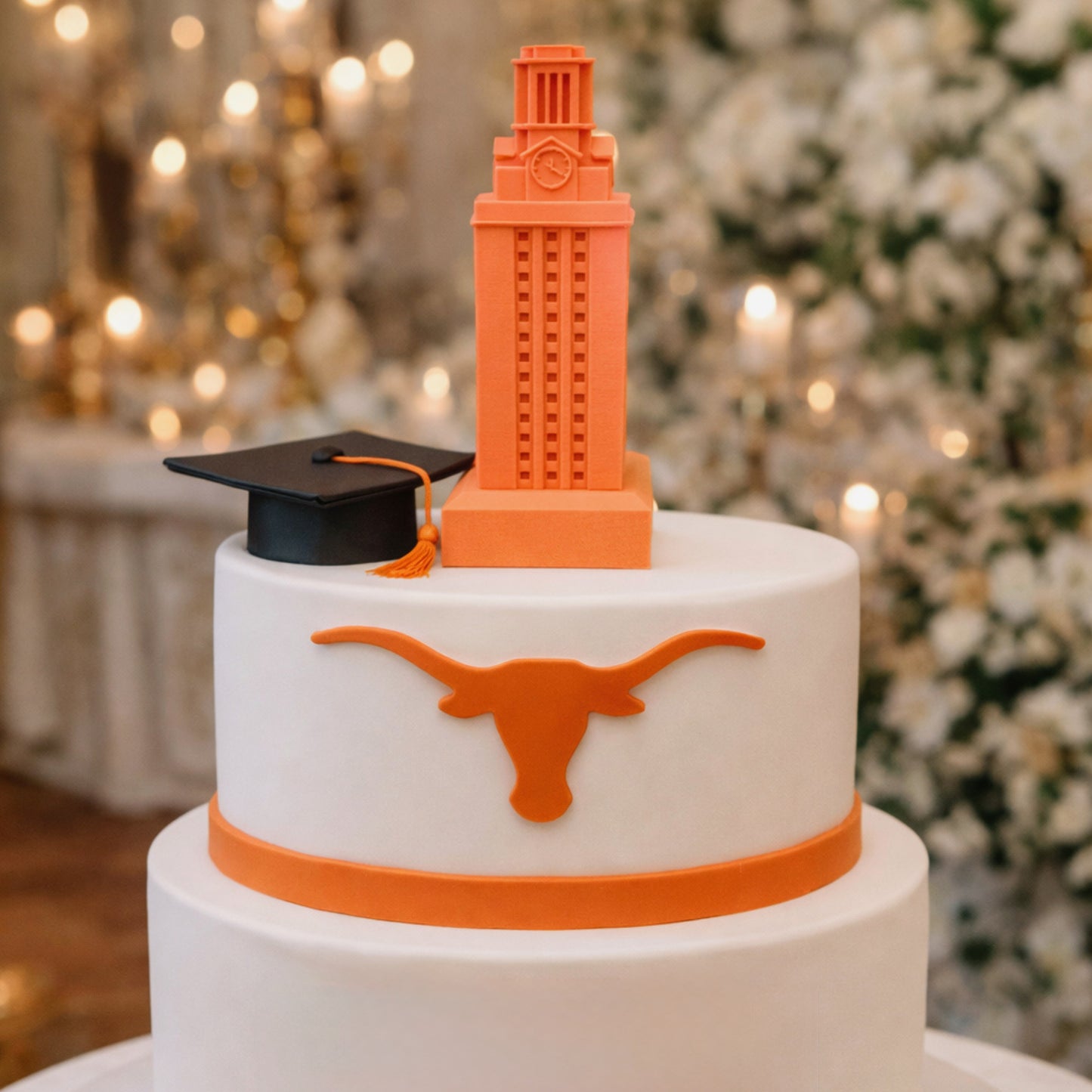 UT Tower cake topper on top of a University of Texas Graduation cake.