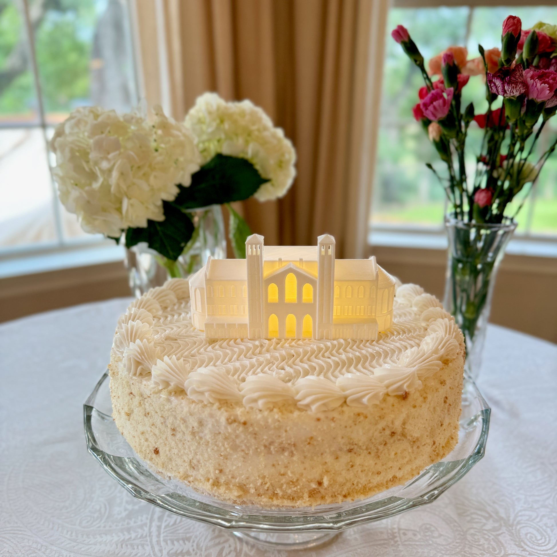 The UCLA cake topper light, shown on a college graduation cake