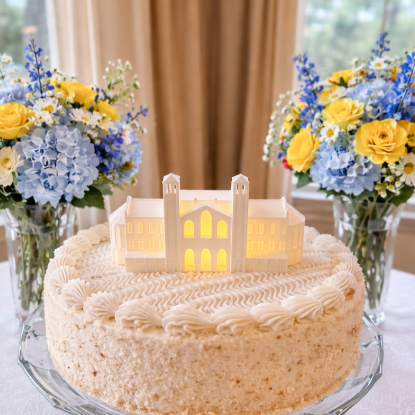 The UCLA cake topper figurine, designed as an LED light that represents the UCLA Royce Hall building.