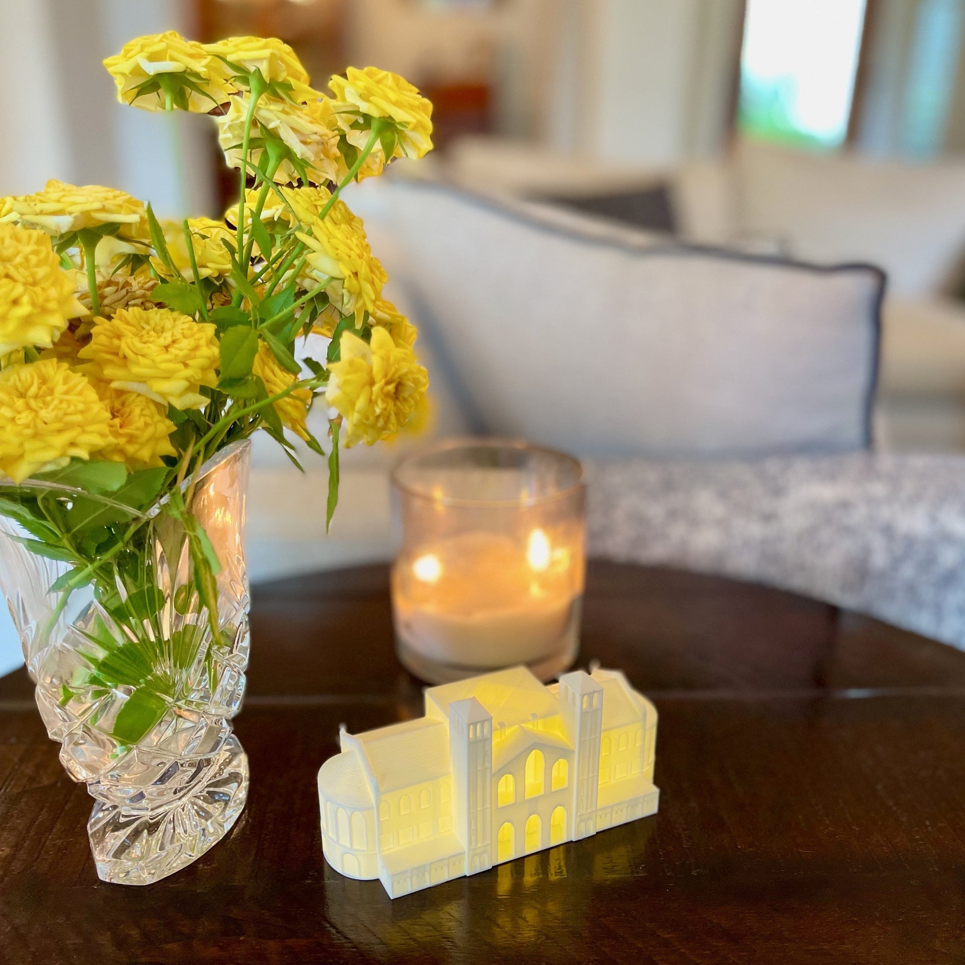 The lighted UCLA Royce hall figurine, used as UCLA office decor and shown in a home.