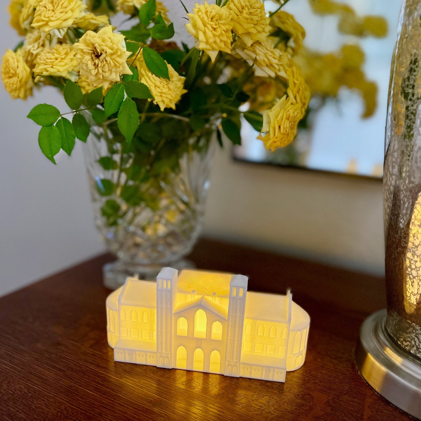 Front view of the UCLA light, used as home decor and shown on a side table.
