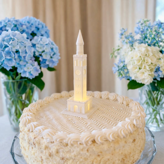 A UNC graduation cake or groom's cake, shown with an LED lighted UNC Bell Tower figurine.