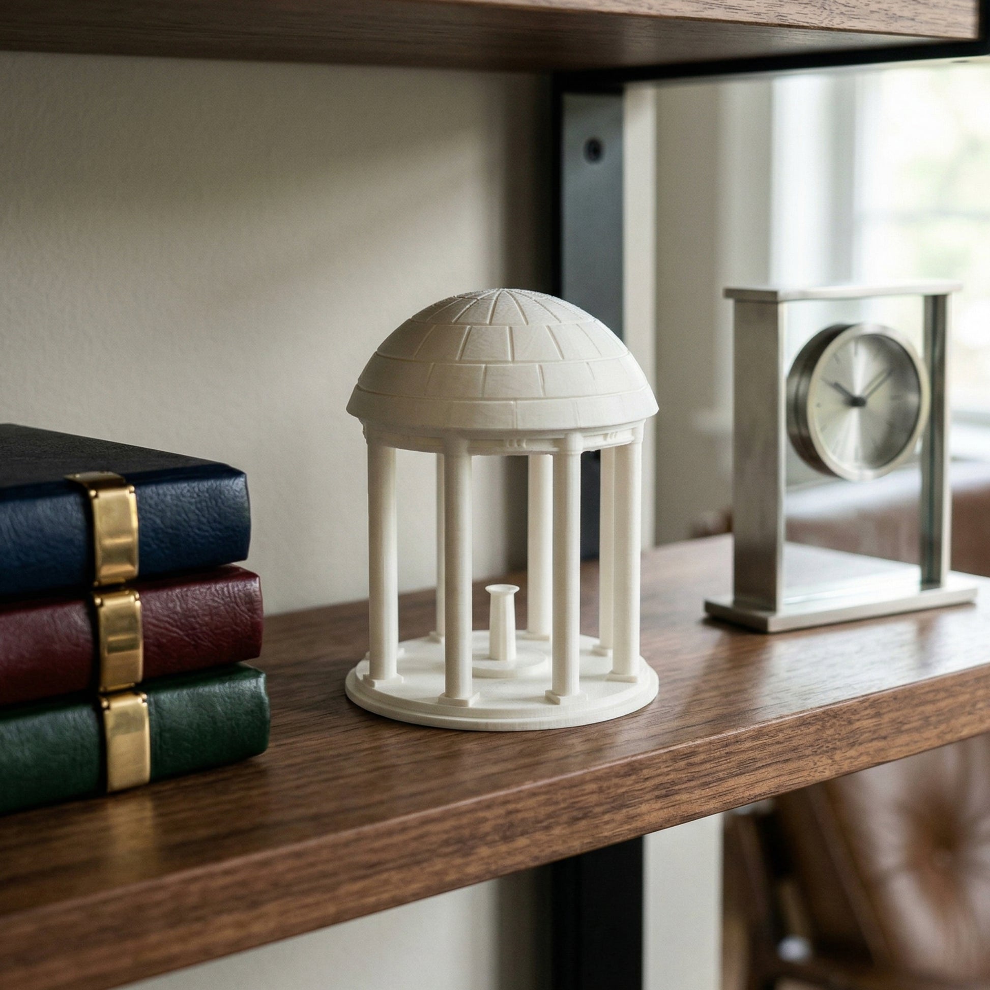 The UNC figurine representing the Old Well, used as office decor.