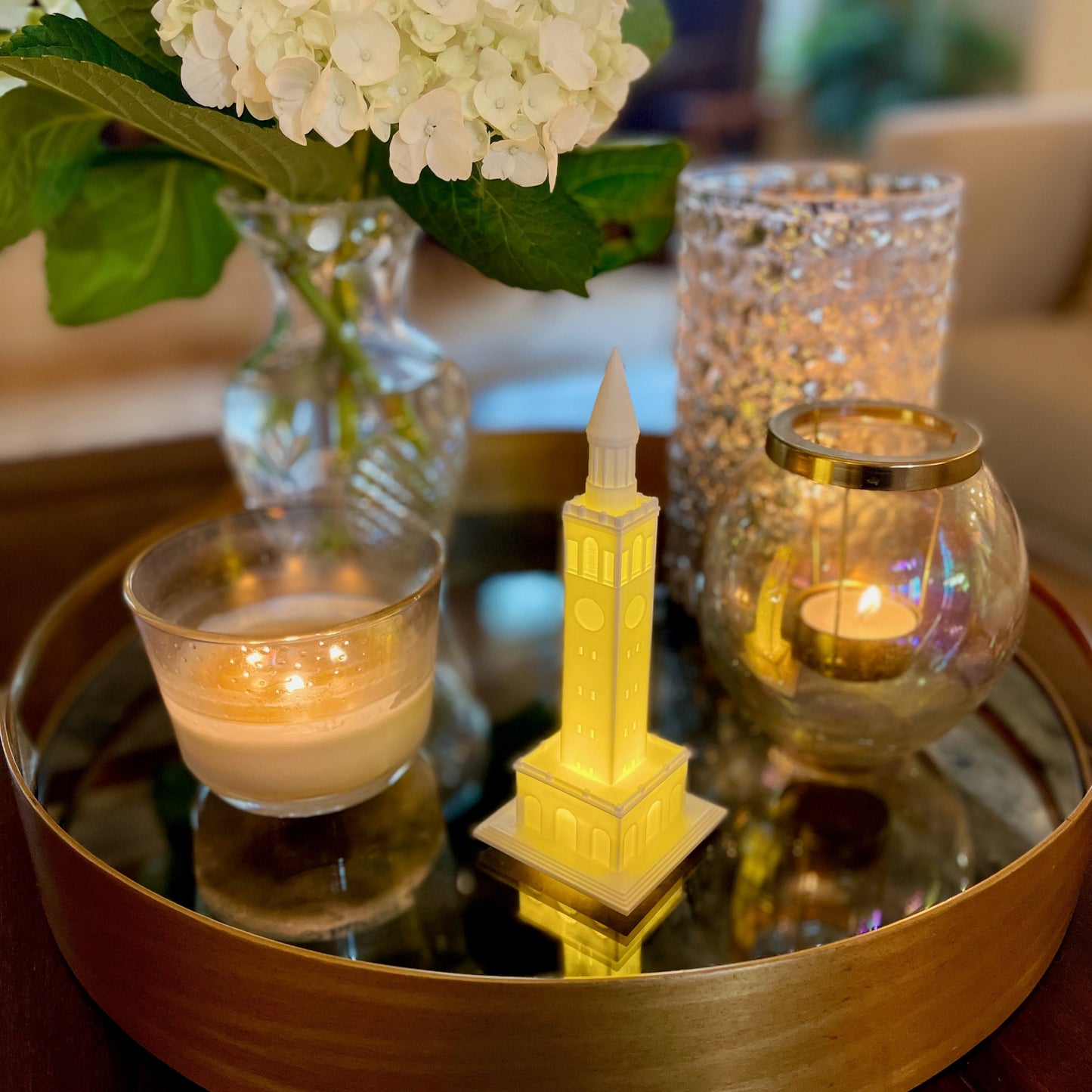 The lighted UNC Tower figurine, shown styled in a dorm.