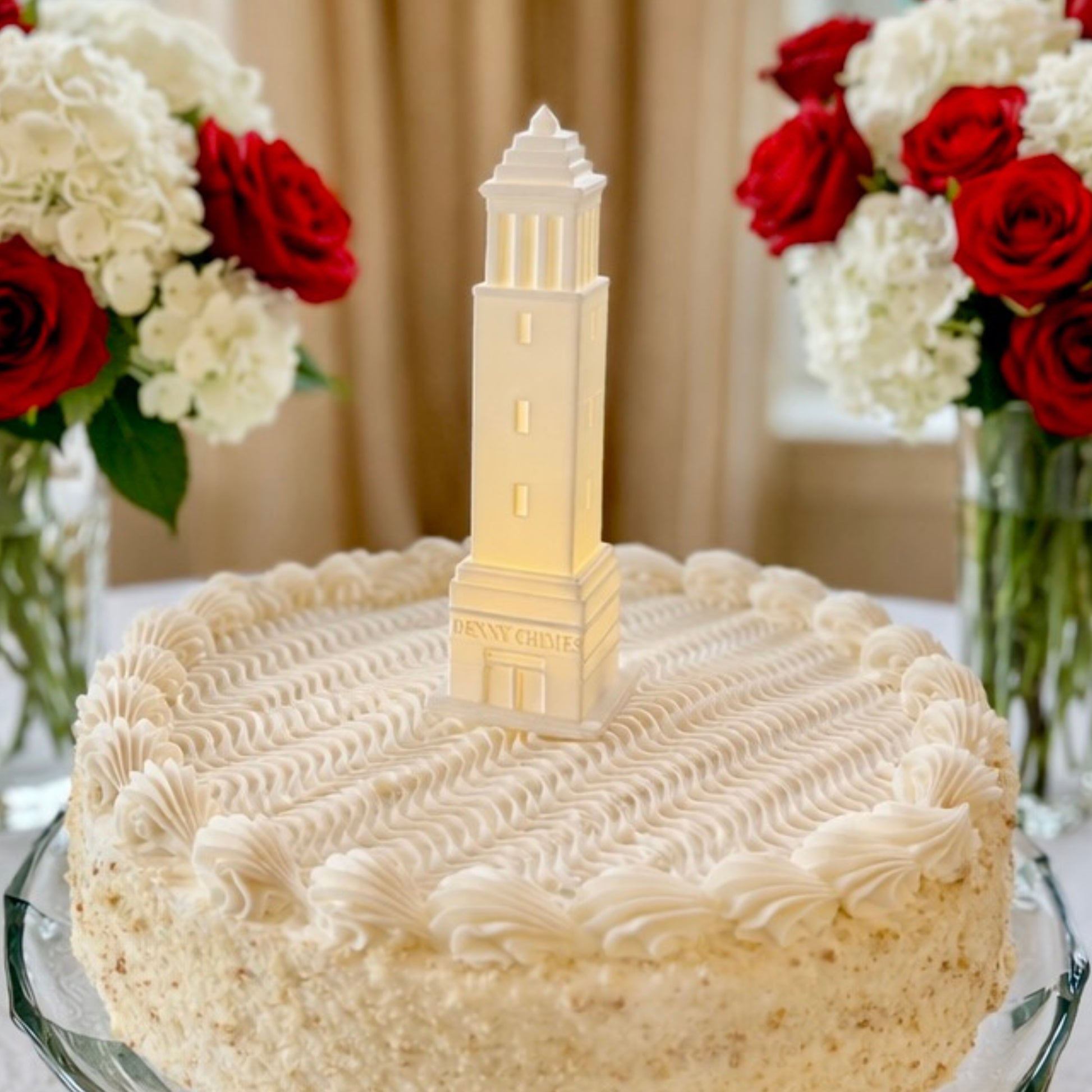 The University of Alabama cake topper with LED light, designed as a replica of the Denny Chimes building on the Tuscaloosa campus and shown on a graduation cake or groom's cake.