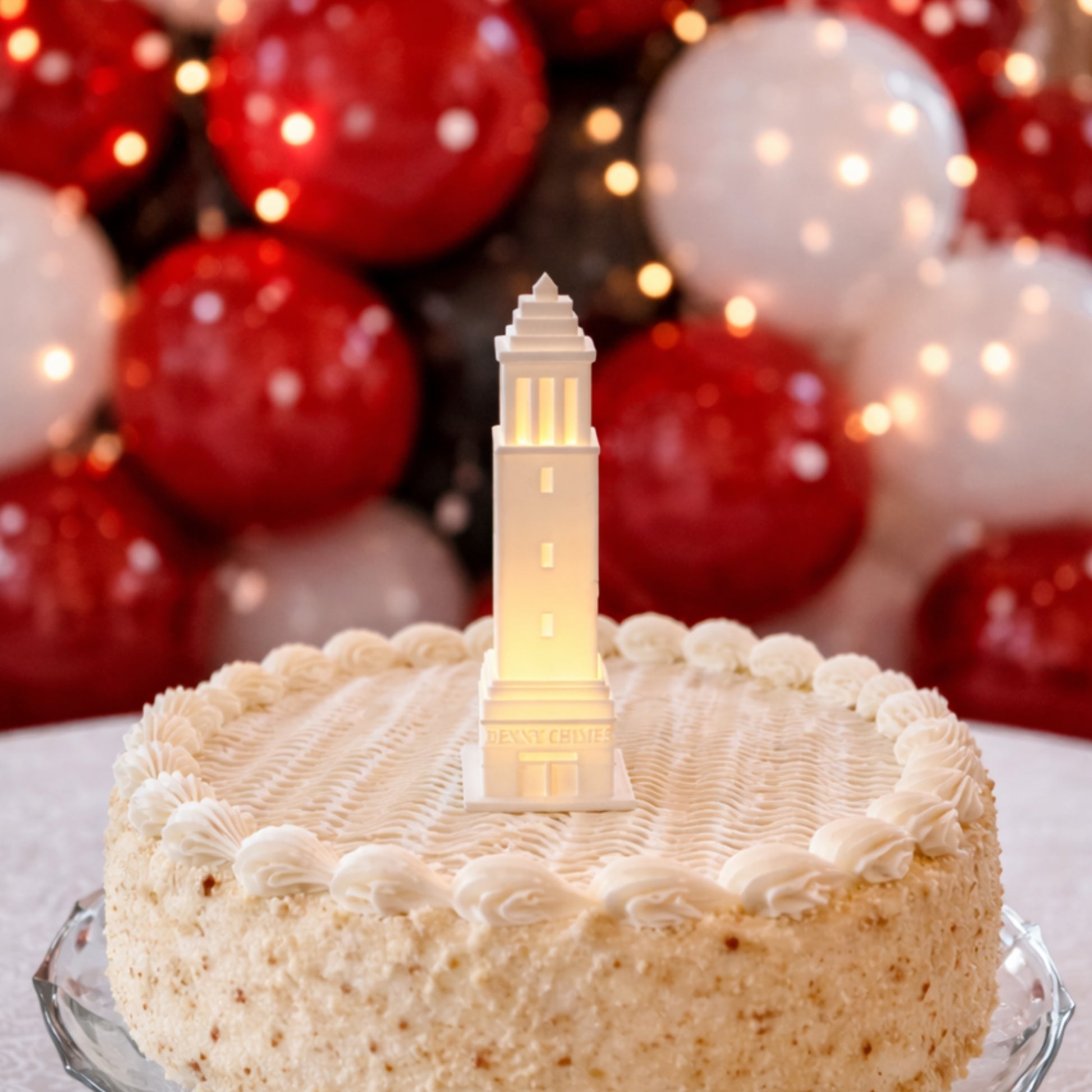 The University of Alabama cake topper light, designed as a replica of the Denny Chimes campus building.