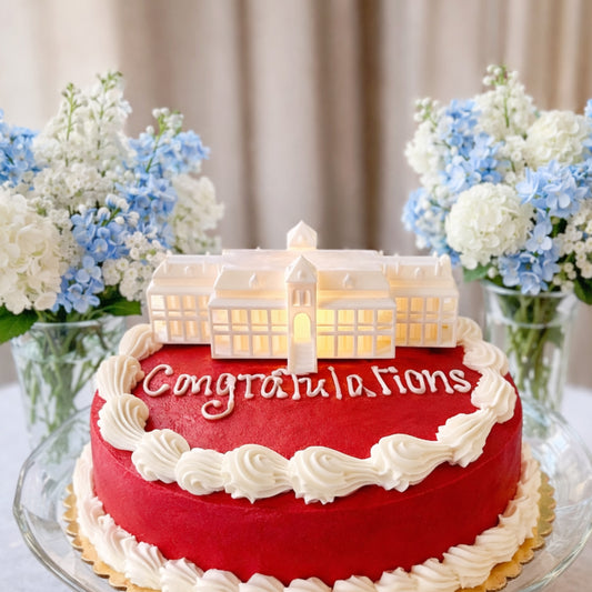 A University of Arizona cake topper, designed with an LED light as a replica of the Old Main building on campus.