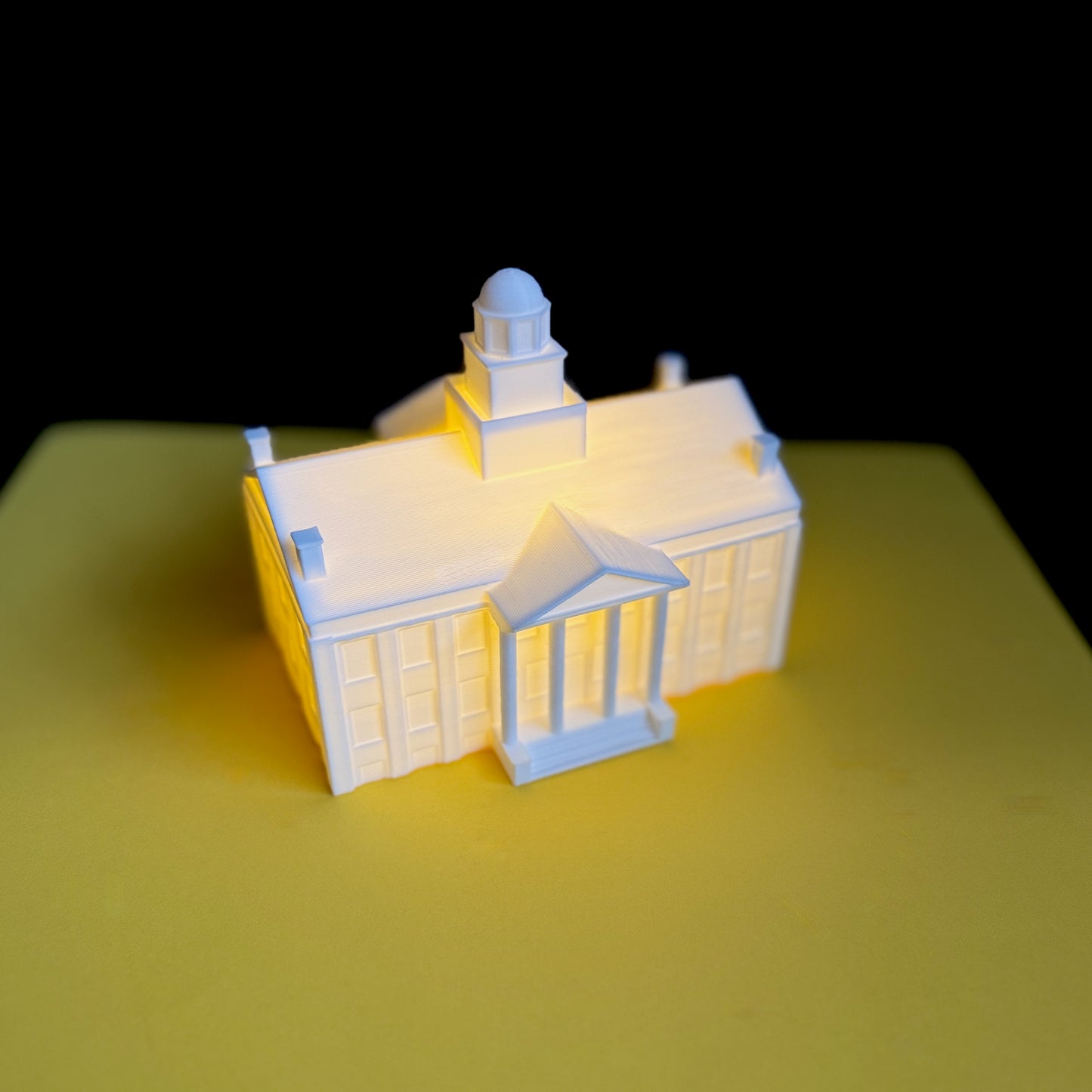 Light-up miniature of Iowa’s Old Capitol Building – handmade college collectible with soft yellow glow