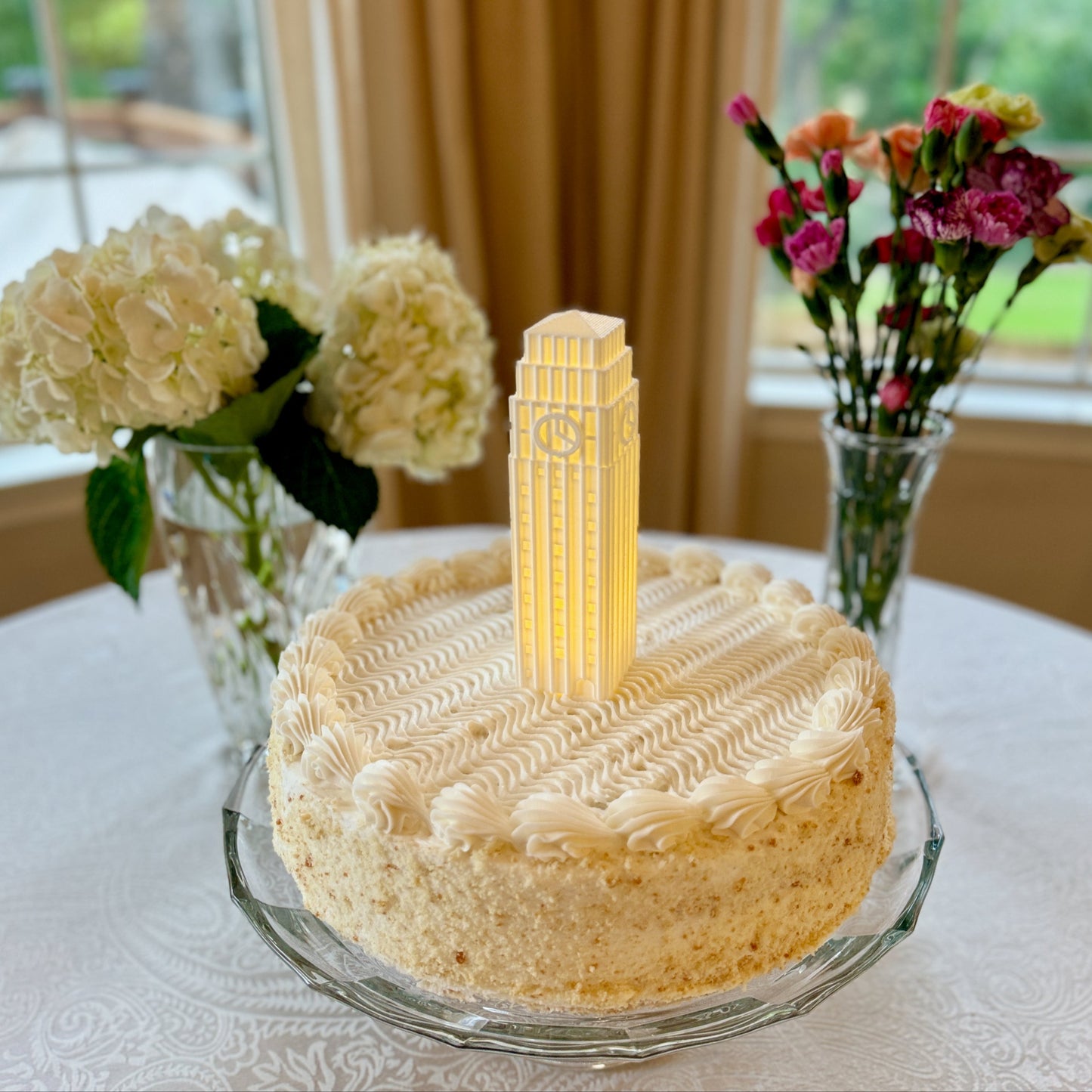The University of Michigan cake topper light, depicting the Burton Tower.