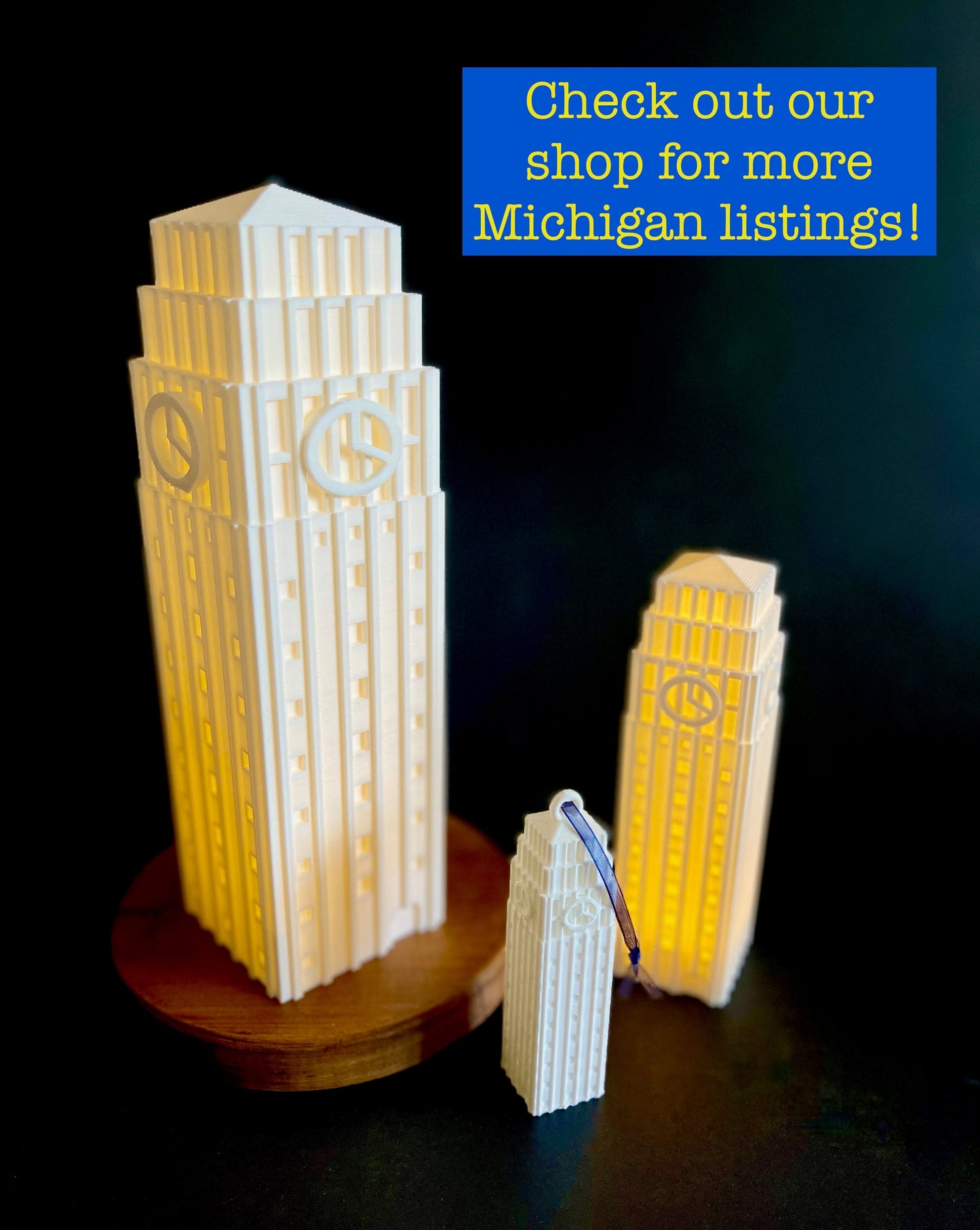 The University of Michigan gifts, figurines designed as replicas of the Burton Tower on campus, shown in a group.