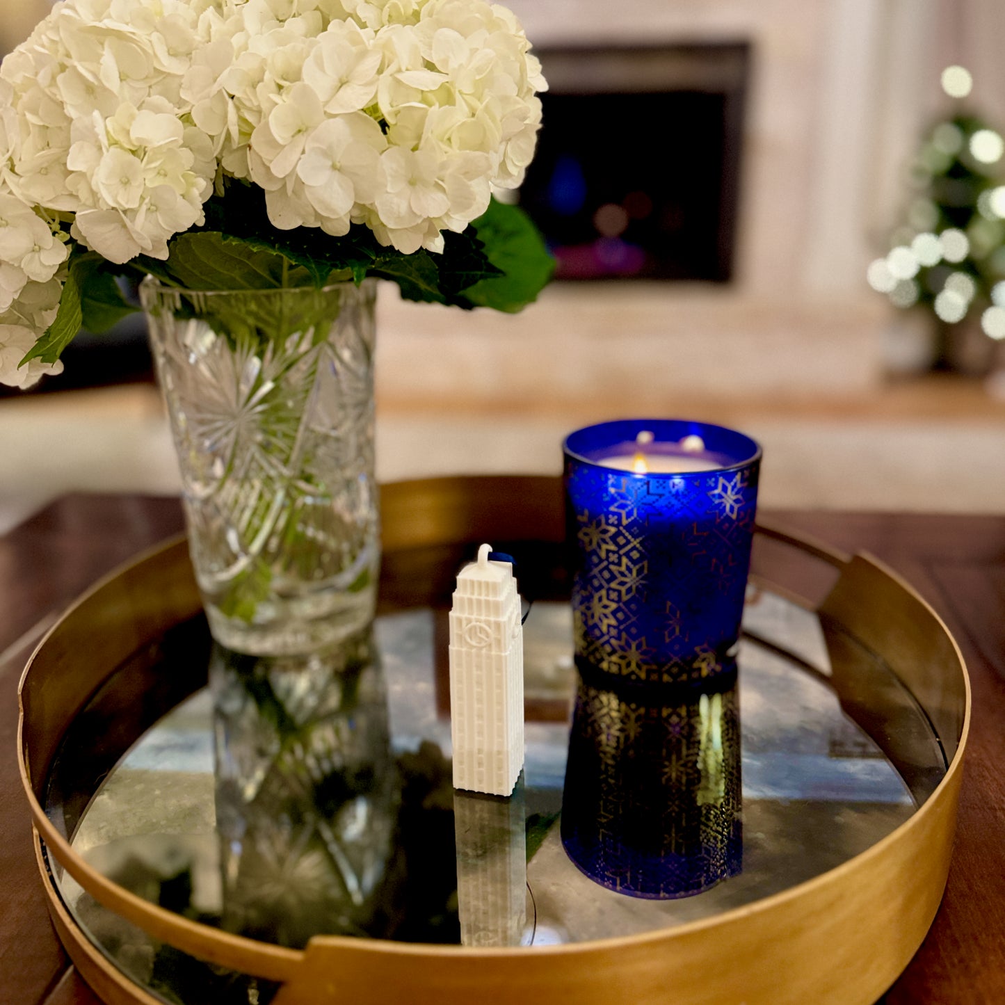 the University of Michigan ornament shown in a home decorated for the holidays and designed as a replica of Burton Tower on campus.
