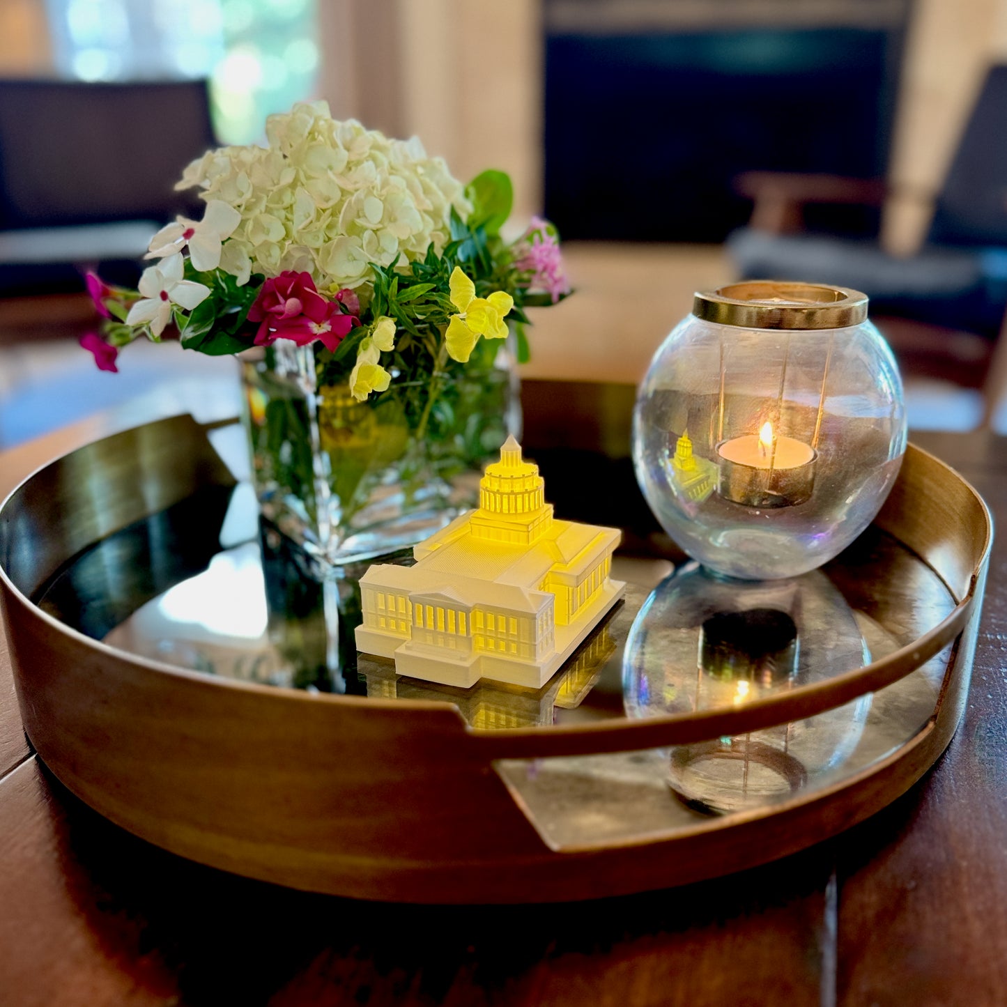 Close-up of LED glow highlighting architectural details of 3D printed Rush Rhees Library model, displayed as home decor.