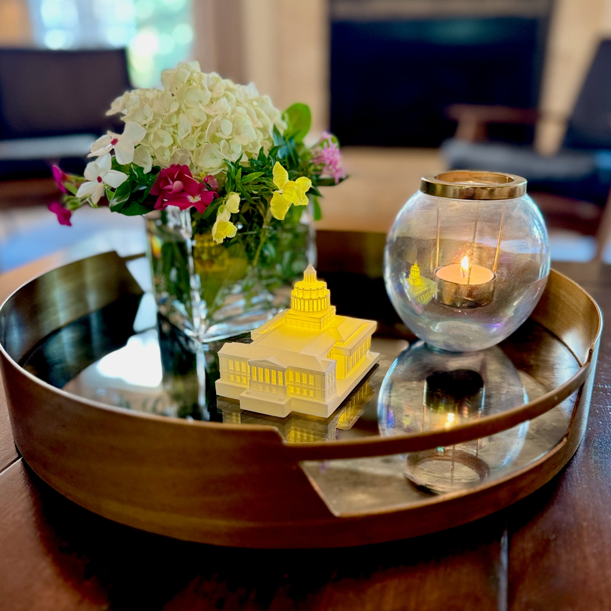 Close-up of LED glow highlighting architectural details of 3D printed Rush Rhees Library model, displayed as home decor.